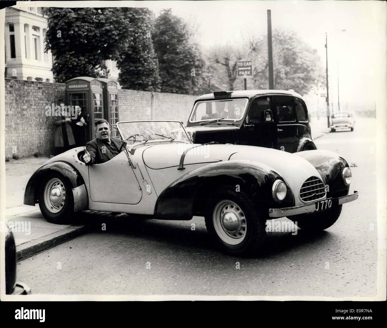 May 06, 1958 - Bes Strike Leader uses 30 H.P. Car to get around London In. Mr. Tom Fitzpatrick, 48 year old chairman of the London Bus Strike Committee - a trolleybus drivers from Highgate - was to be seen travelling around London yesterday - first day of the bus strike - on strike business - in a 30 h.p. sports car. He pointed out that the car was on loan to him for strike business. Photo shows Mr. Tom Fitzpatrick - in the sports car yesterday. Stock Photo