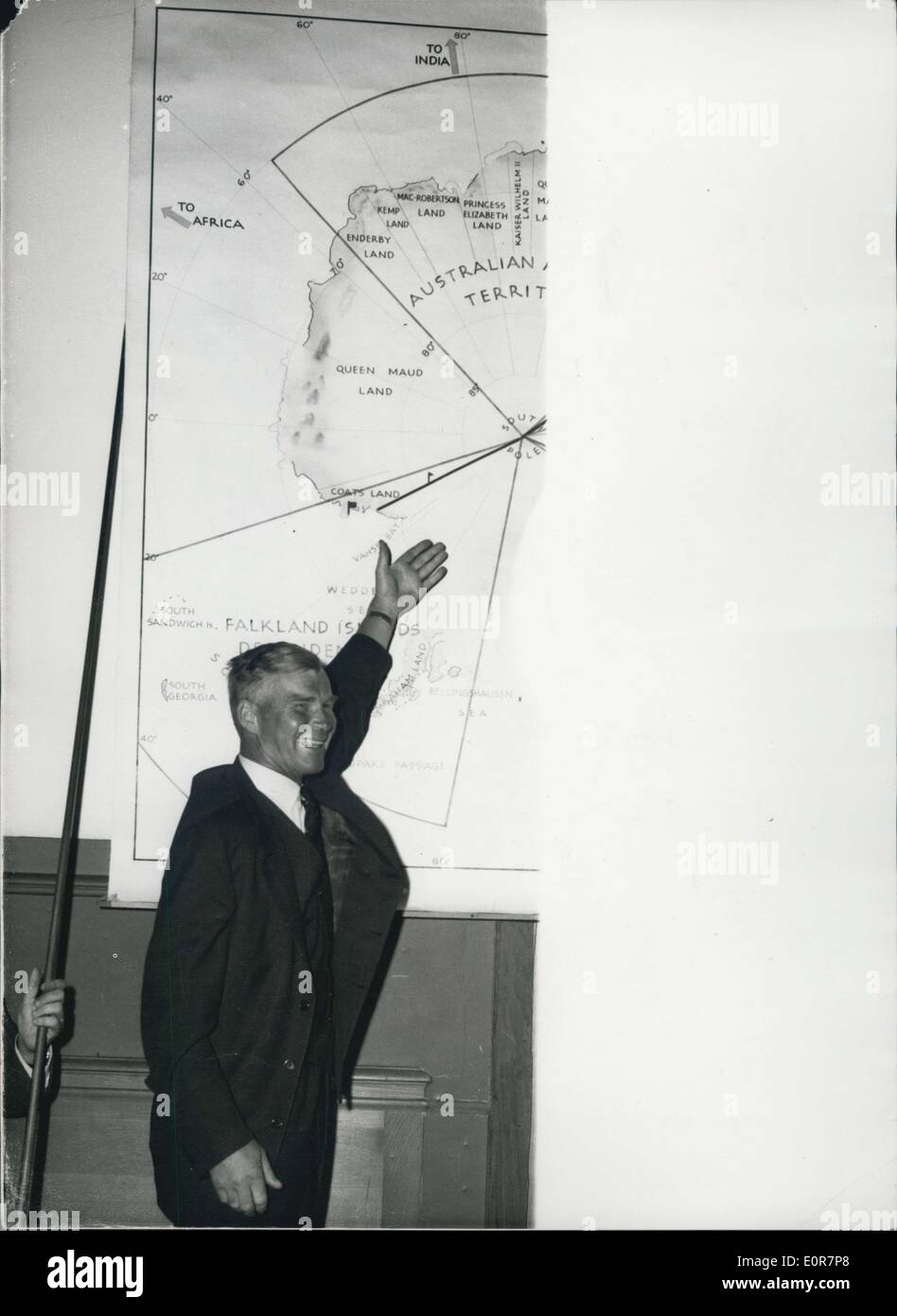May 12, 1958 - Transantarctic Expedition returns to London: Dr. Vivian Fuchs and members of his Transantarctic Expedition-returned to London this afternoon and received a great welcome. A press reception was held at the Royal Geographical Society Headquarters. Photo shows Dr.Fuchs points out his route on a well map of Antarctica-at the press reception this afternoon. Stock Photo