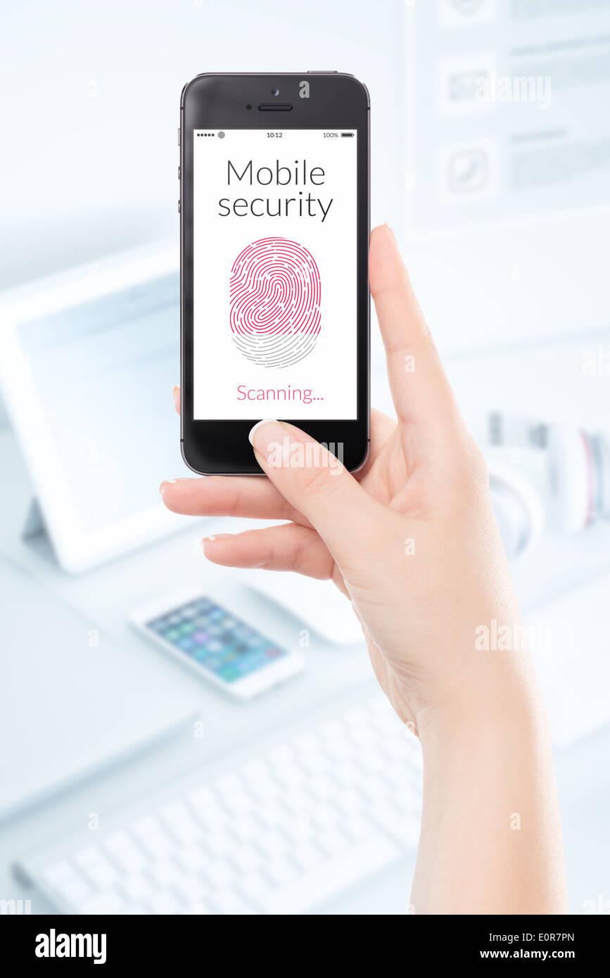 Woman hand is scanning fingerprint by modern black smartphone. Mobile security concept. Stock Photo