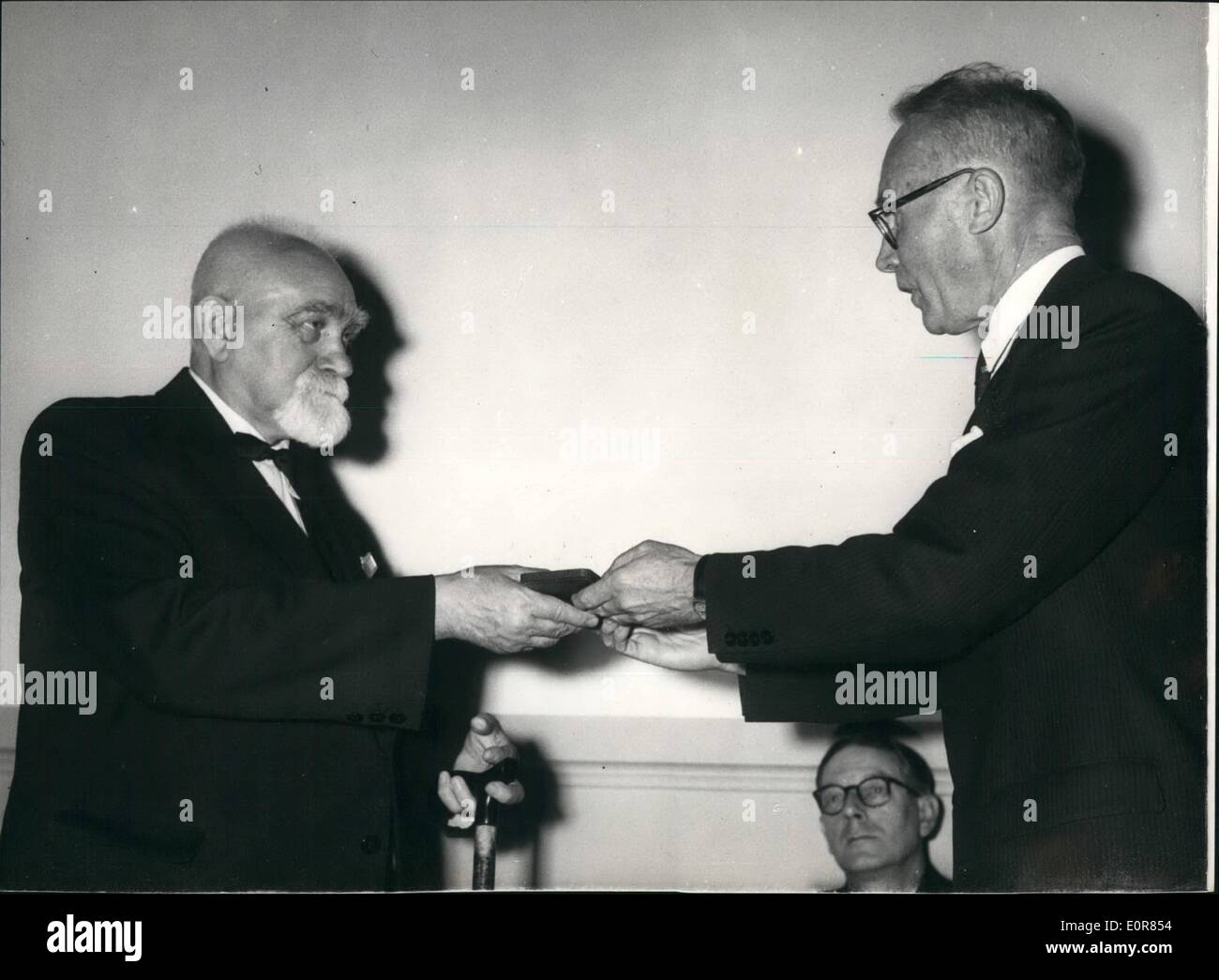 Jul. 07, 1958 - Biologists receive Darwin medal: British and foreign botanists and zoologists nominated for the award of a silver Darwin - Wallace Commemorative Medal in recognition of their outstanding contribution to the knowledge of evolution, were presented with the Medal at a meeting of the Linnean Society, at the Royal Geographical Society today. Photo shows Academician Eugene Pavlosky, receiving his Medal, this afternoon. Stock Photo