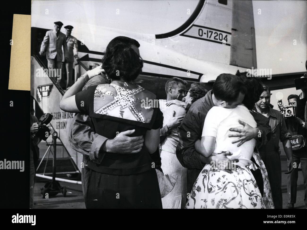 Jul. 07, 1958 - Released US-pilots in Wiesbaden The nine American pilots, who had been forced to land in Armenia by Russian planes, July 27, 58, after having been released, were arriving at the American Military Airfield in Wiesbaden-Erbenheim. Our picture shows:- Happy wives embracing the returned men. Stock Photo