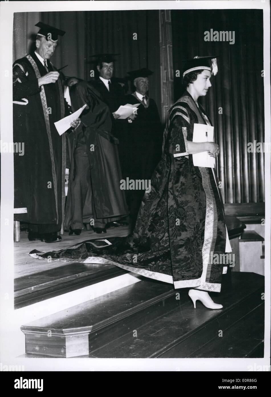 Jul. 07, 1958 - Princess Margaret presents degrees: H.R.H. Princess Margaret, wearing Academic robes. Leaves the platform in the Hall at the North     which she is President, at Keele, Staffordshire, after presenting Degrees to more than 130 Graduates at the annual congregation of the University College yesterday. It was the third time the Princess has presented degrees at the annual Congregation. Behind the Princess is Sir George Barnes, Principal of the College. Stock Photo