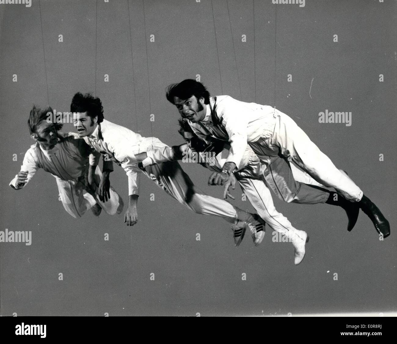 Jul. 07, 1958 - (L. to r.) Peter Tork, Micky Dolenz, Davy Jones and Mike Nesmith - the Monkees, looking rather windswept in a flying sequence form their new film. Stock Photo