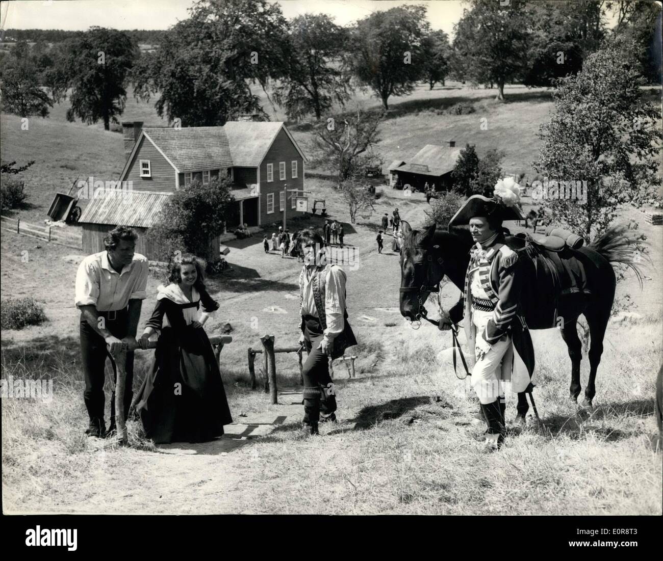 Jul. 07, 1958 - American Village Constructed At Tring Park For Film: Shooting started this morning on ''The Devil's Disciple'' - the Bernard Shaw satire on the American War of Independence - at Tring Park, Herts.- The American village of Westerbridge has been constructed in the park as a background for the film which stars. Sir Laurence Olivier - Burt Lancaster - Janette Scott, etc. Photo shows General view of the village - with on the hillside the four stars of the film - L-R:- Burt Lancaster (Rev Stock Photo