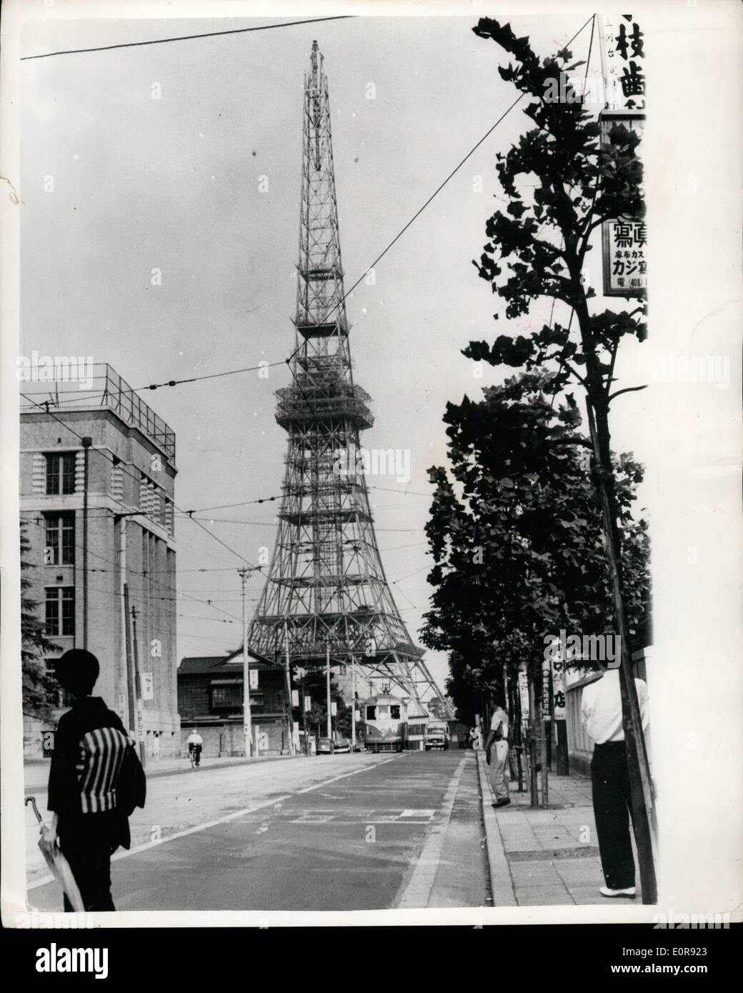 Aug. 08, 1958 - Tokyo's ''Eiffel Tower'' going up fast: Tokyo's new television tower - which is very like the Paris Eiffel Tower - but taller - is now well past the second stage of construction at Shiba Park, Tokyo.. Air Line companies are getting worried about its effect on aircraft from the machines have to make a turn nearby - and in misty weather it could be hard to sec... The tower, however is to be equipped with flashing lights that can be seen fifty miles away. Photo shows Tokyo's ''Eiffel Tower'' reaching is final b- top storey. Stock Photo