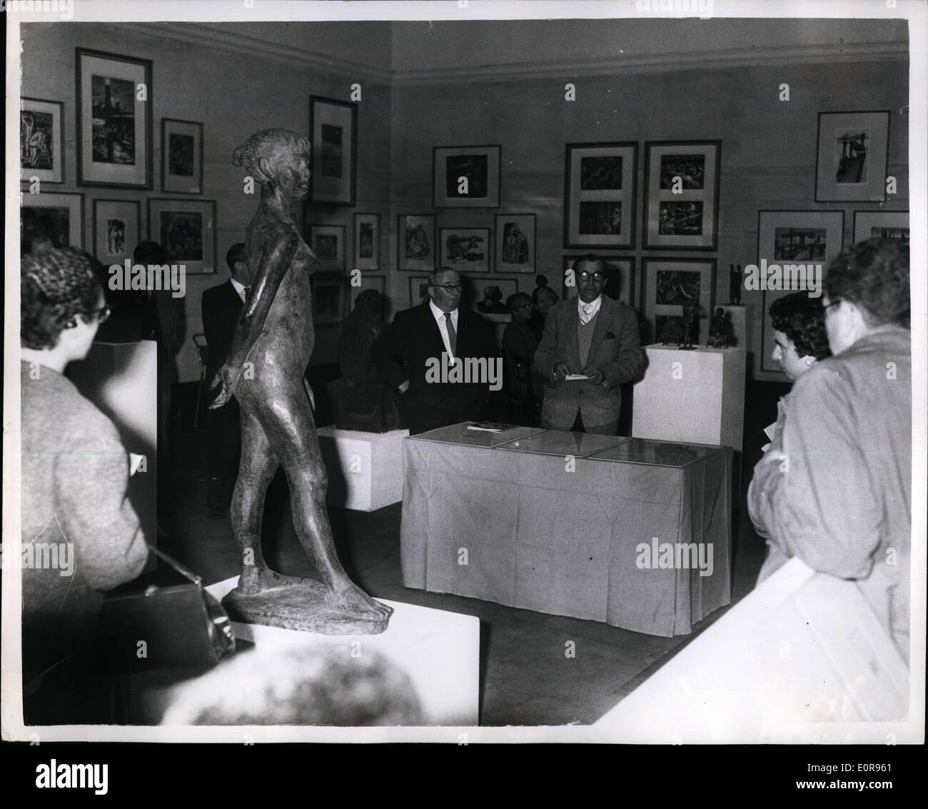 Oct. 10, 1958 - Opening Of The Contemporary German Graphic Art And Sculpture In London: For the first time in this country- an exhibition of Contemporary German Graphic Art and Sculpture-is being held at the Royal Society of British Artists Galleries, S.W.1. The exhibition was opened today by Herr Bodo Uhse, member of the Council of the German Academy of Arts. Photo shows,. Herr Bodo Uhse (centre in light suit) opening the exhibition today. Stock Photo