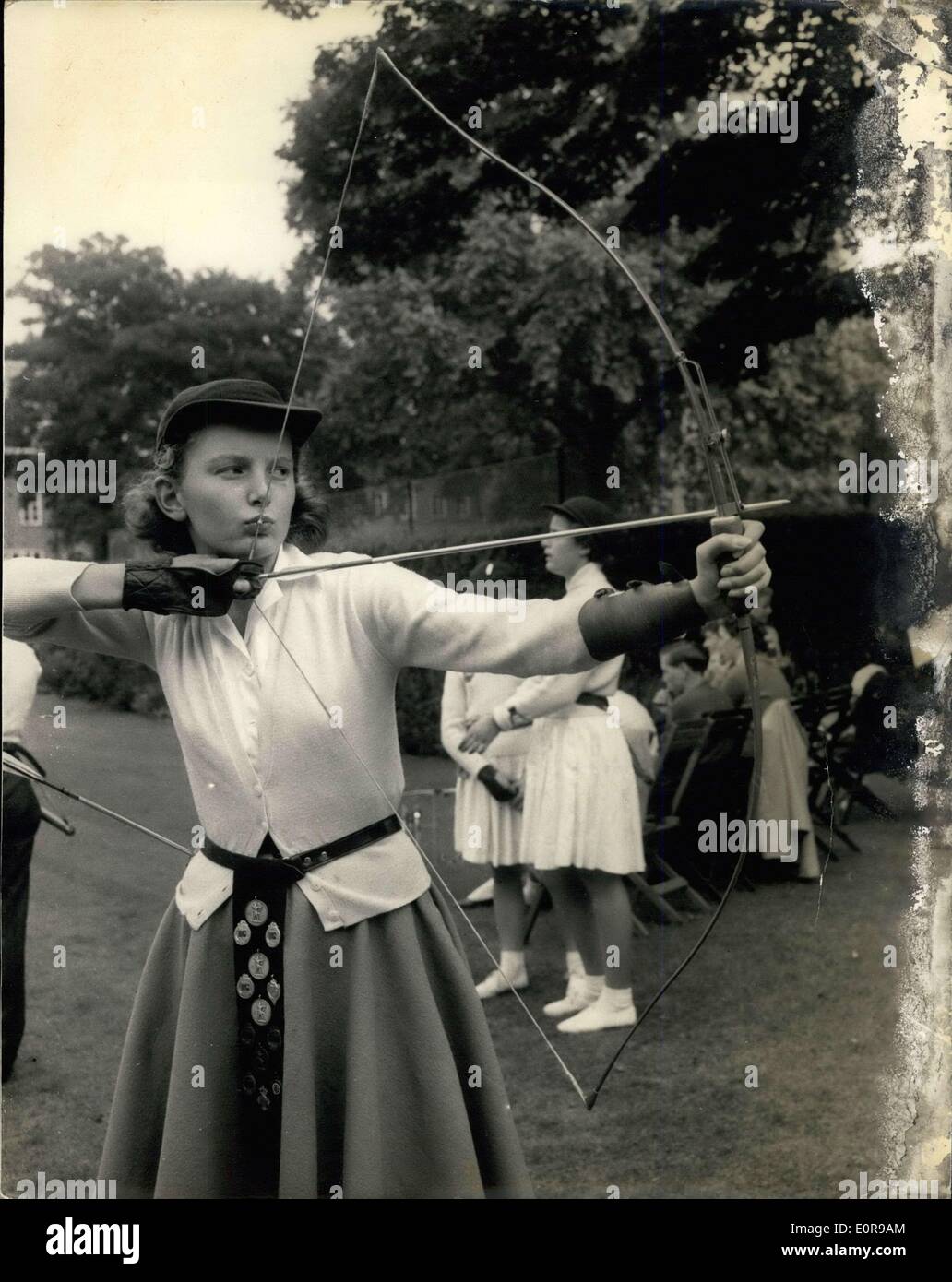 Aug. 29, 1958 - Boys and Girls Archery Championships.. The boys and girls Archery Championships opened this afternoon at the Royal Toxophillite society ground, Hydepark. Photo shows Susan Osborne, age 13 , of the Colchester Archery Club, who has won the championship in 1956-57, when she broke two records, displaying 14 senior championship medals during the competition today. Stock Photo