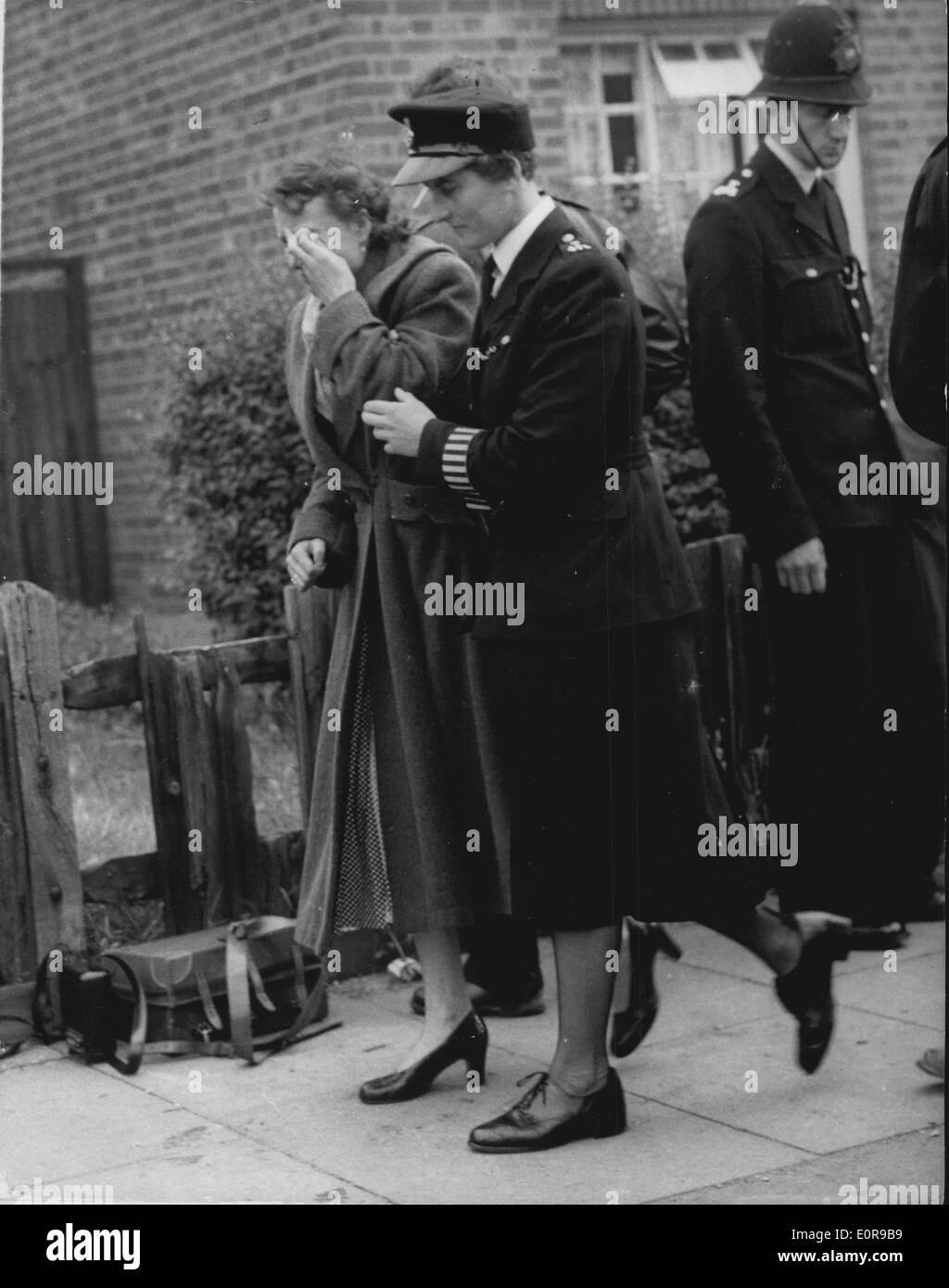 Sep. 02, 1958 - Viking Airliner Crashes On To Houses AT Southall - A neighbour Weeps: Eight people - including the w of three Stock Photo