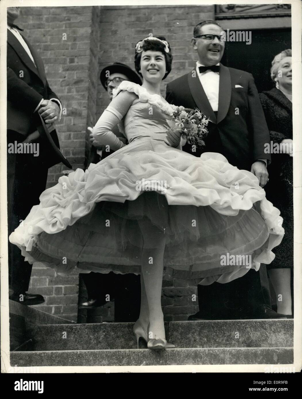 Oct. 10, 1958 - Hula-Hoop Whirl. Bridesmaid's Unusual Dress.: Sandra Kruger ''stole the show'' - with her hula-hoop dress - when she took on the role of bridesmaid yesterday at the wedding of her brother Jeffrey 27 year old managing director of a Munich film and record company to 21 year old model Rene Fifer, at Cricklewood, N.W. Synagogue. Photo shows Sandra Kruger with her hula-hoop skirt dress - at the wedding today. Stock Photo