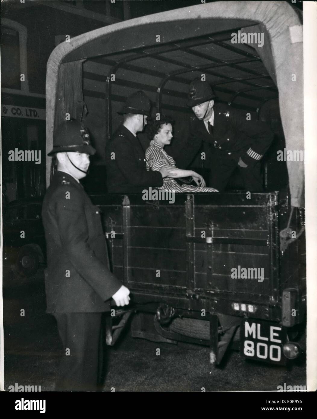Sep. 09, 1958 - Black - White racial riots once again in Notting Hill Gate. Woman in a Police van: Many arrests were made last night in the Black White racial riots which broke out again for the fourth night in succession in the Notting Hill Gate area of London. Photo shows a woman in a police wagon after the riots in Blenheim Crescent, Notting Hill Gate last night. Stock Photo