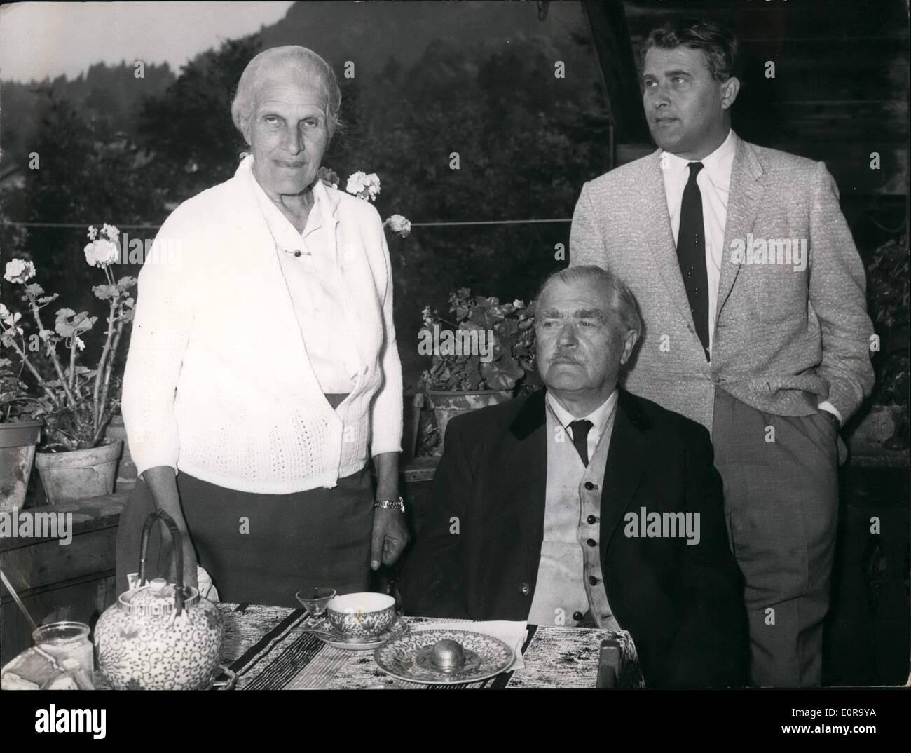 Sep. 09, 1958 - The Rocket specialist Wernher Von Braun: Spends some days of recreation with his parents in the Bavarian village Oberaudorf. During the Astronautic congress in Amsterdam he was not quite well so he decided to use his short stay in Europe to visit his parents. Picture Shows: F.l.t.r. baroness Von Braun. baron Magnus Von Braun and Dr. Wernher Von Braun on the Balkon of his parent's house in Oberaudorf. Stock Photo