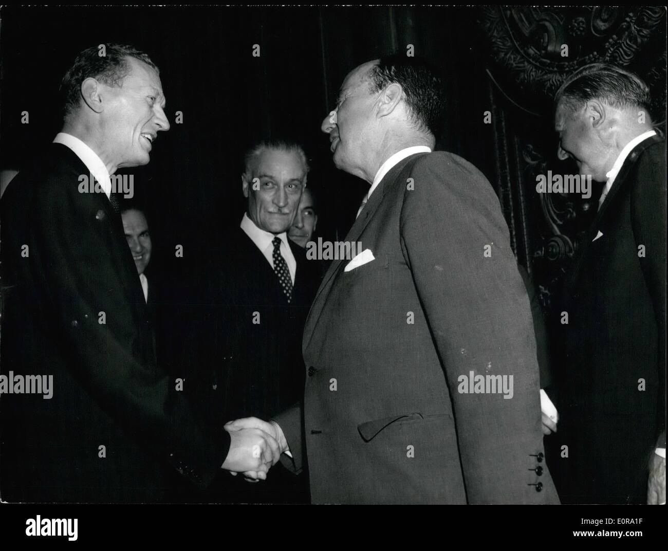 Sep. 09, 1958 - Adlai Stevenson at Quai D'Orsay Photo Shows Adlai Stevenson shakes hands with M. Couve De Murville, french Foreign Minister, as he was received at the Quai D'Orasy this afternoon. Stock Photo