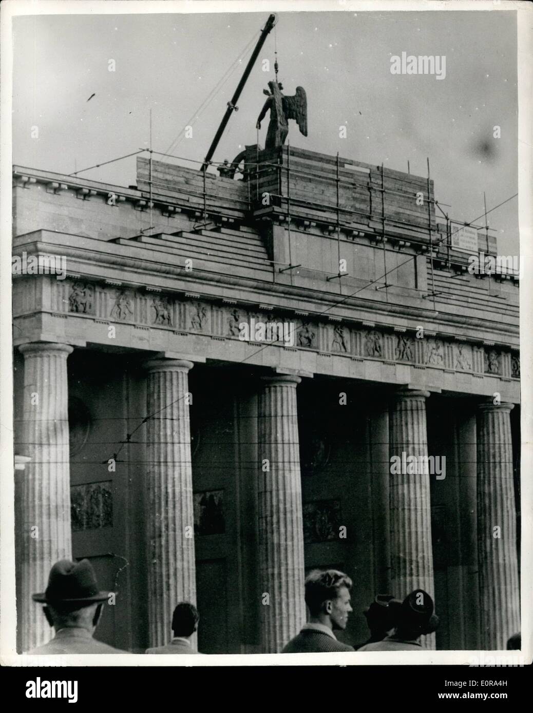 Sep. 09, 1958 - Berlin Gets Her ''Goddess Of Victor  With Out Her Iron Cross And Prussian:Berlin's Goddess of  to her Chariot on top of the Brandenburg and West Berlin recently - but she was  eith out the symbols of Prussian militarist  was one of the most famous monuments destroyed by Russian artillery in World War  the two section decided to collaborates -  was completely recast with standard which  Iron Cross and Prussian Eagle, and handed over  Berliners. The Communists removed the  she was returned to her former seat Stock Photo