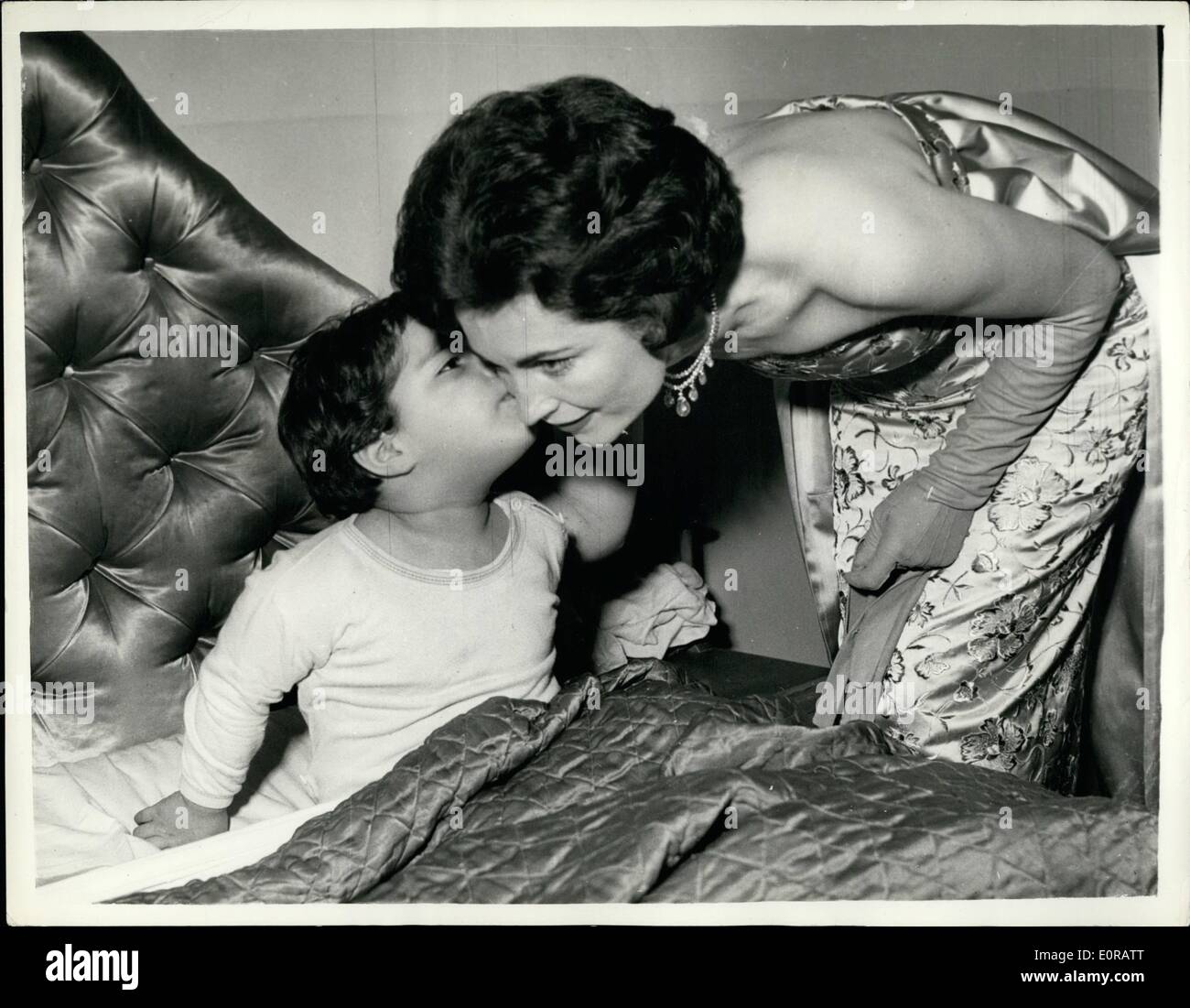 Nov. 11, 1958 - Wife Of The Bolivian Ambassador And Her Young Daughter: H.M. The Queen held a party at Buckingham Palace last night for foreign diplomat. Photo shows  Teresa Estenssoro, wife of the Bolivian Ambassador to London says good night to her three year old daughter Patricia before leaving for the palace last night. Stock Photo