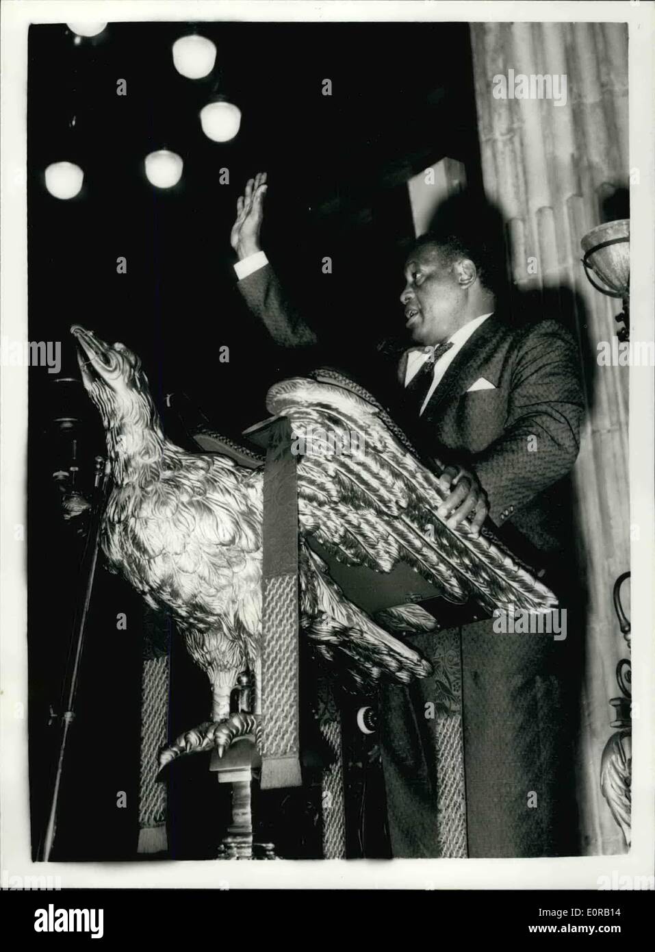 Oct. 10, 1958 - Paul Robeson at St. Paul's: The famous singer Paul Robeson today went to St. Paul's Cathedral, to choose the position from which he will sing at the evening service there on October 12. The collection will go to the Defence and Aid Fund for the South African treason trails. Photo shows Paul Robeson photographed on the lectern when making today's test in St. Paul's. Stock Photo