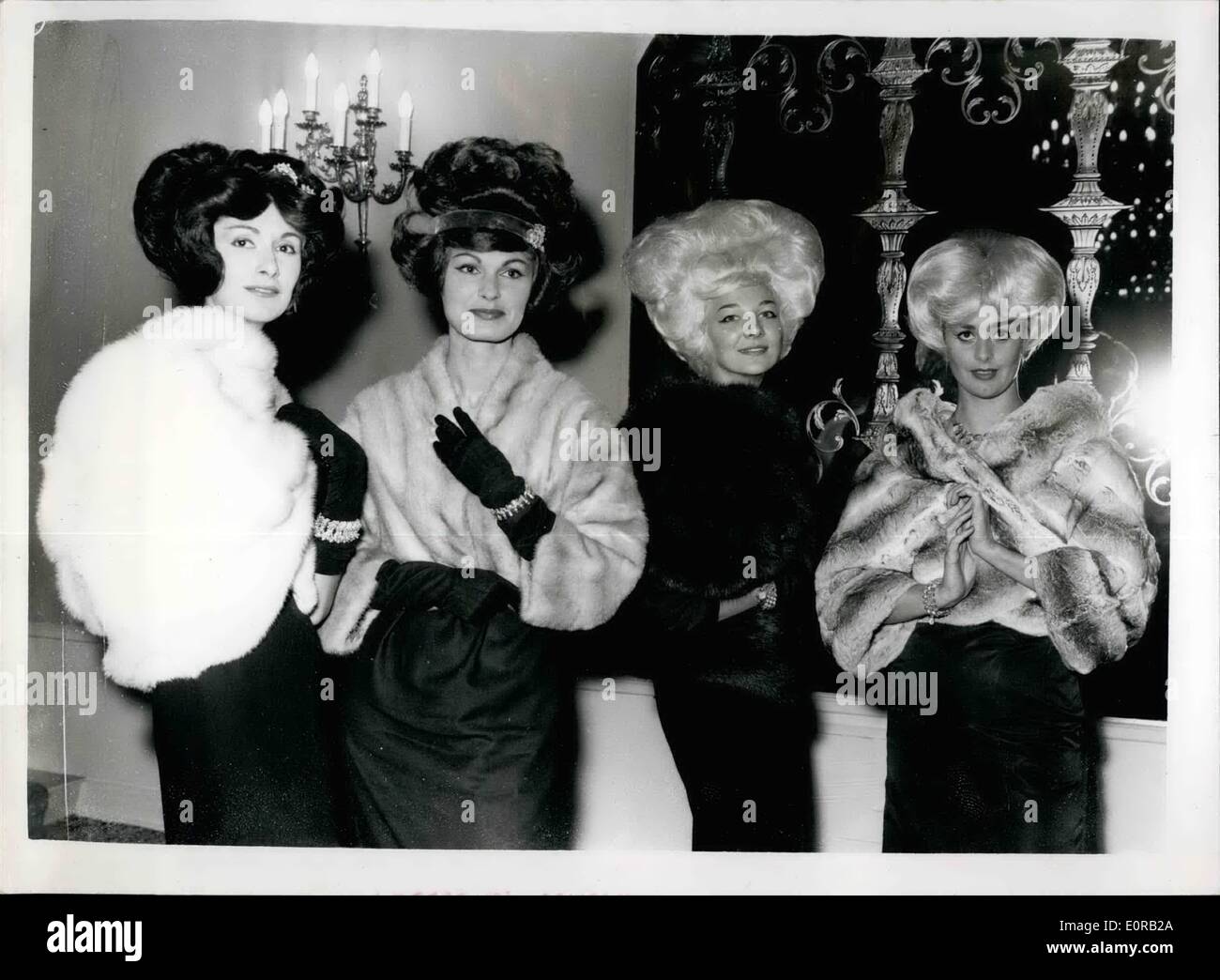 Oct. 10, 1958 - Fur fashion show in London. 'Furs for a Darling Daughter' - is the name given to a display of fur styles presented by the national fur company in aid of the national society for the prevention of cruelty to children - at Quaglino's, this afternoon. Photo shows:- L-R:- Barbro Mendoza wears a Jasmin white mink cape (&pound;975); Ilona Ballard wears of a diadem mink (&pound;795); Jeannette McConnell in a Canadian blended Sable (&pound;750) ans Ann Gyrsting inan Empress Chinchilla Bolero - priced at &pound;1350. Stock Photo