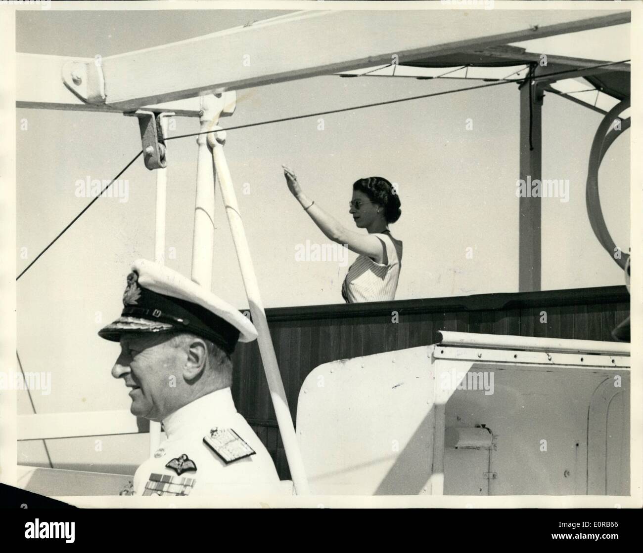 Dec. 12, 1958 - The Royal Tour - Original Picture: The H.M.N.Z.S. Black Prince took over escort duty to the royal tour liner ''Gothic'' in the Pacific, when H.M. The Queen and The Duke of Edinburgh were enroute for Suva. Photo shows H.M. The Queen on the bridge of the ''Gothic'' wavesa greeting to the Black Prince as it took over the escort duty. Stock Photo
