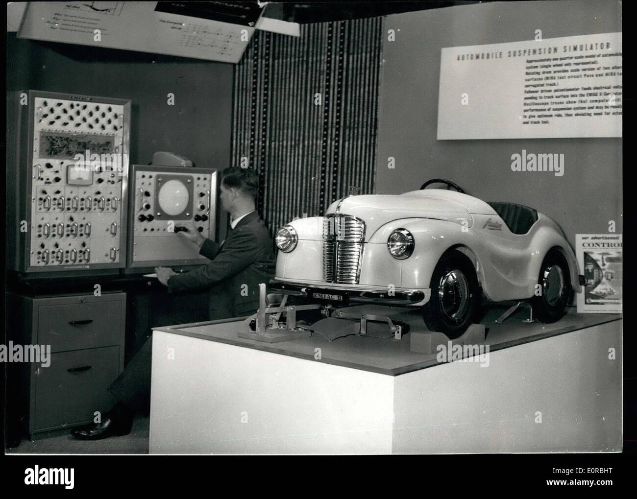 Nov. 28, 1958 - 28-11-58 Lord Mayor opens Electronic Computer Exhibition. The Lord Mayor of London, Sir Harold Gillett this morning opened the Electronic Computer Exhibition at Olympia. Keystone Photo Shows: An operator at the panel controls the Automobile Suspension Simulator, on a model at the exhibition. The quarter scale model shows how E.M.I.A.C.II computer can be used to test car suspension system under varying road conditions. Stock Photo
