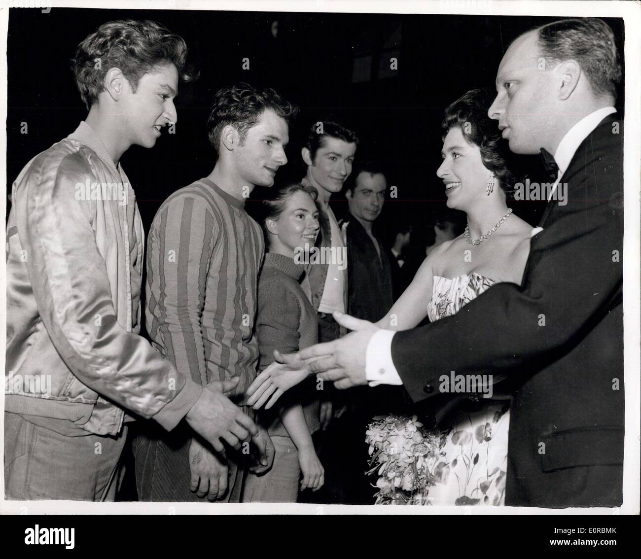 Dec. 12, 1958 - Princess Margaret sees ''West Side Story''. Reviews the Jets.: Princess Margaret laughingly ''review'' a line of 'Jets' at Her Majesty's Theatre - when she saw '' West Side Story'' anew American Musical. The 'Jets' in the show are a gang of 'real' American's who battle with the Puerto Rican gang of 'Sharks'. The Princess wear a new hair style. Stock Photo