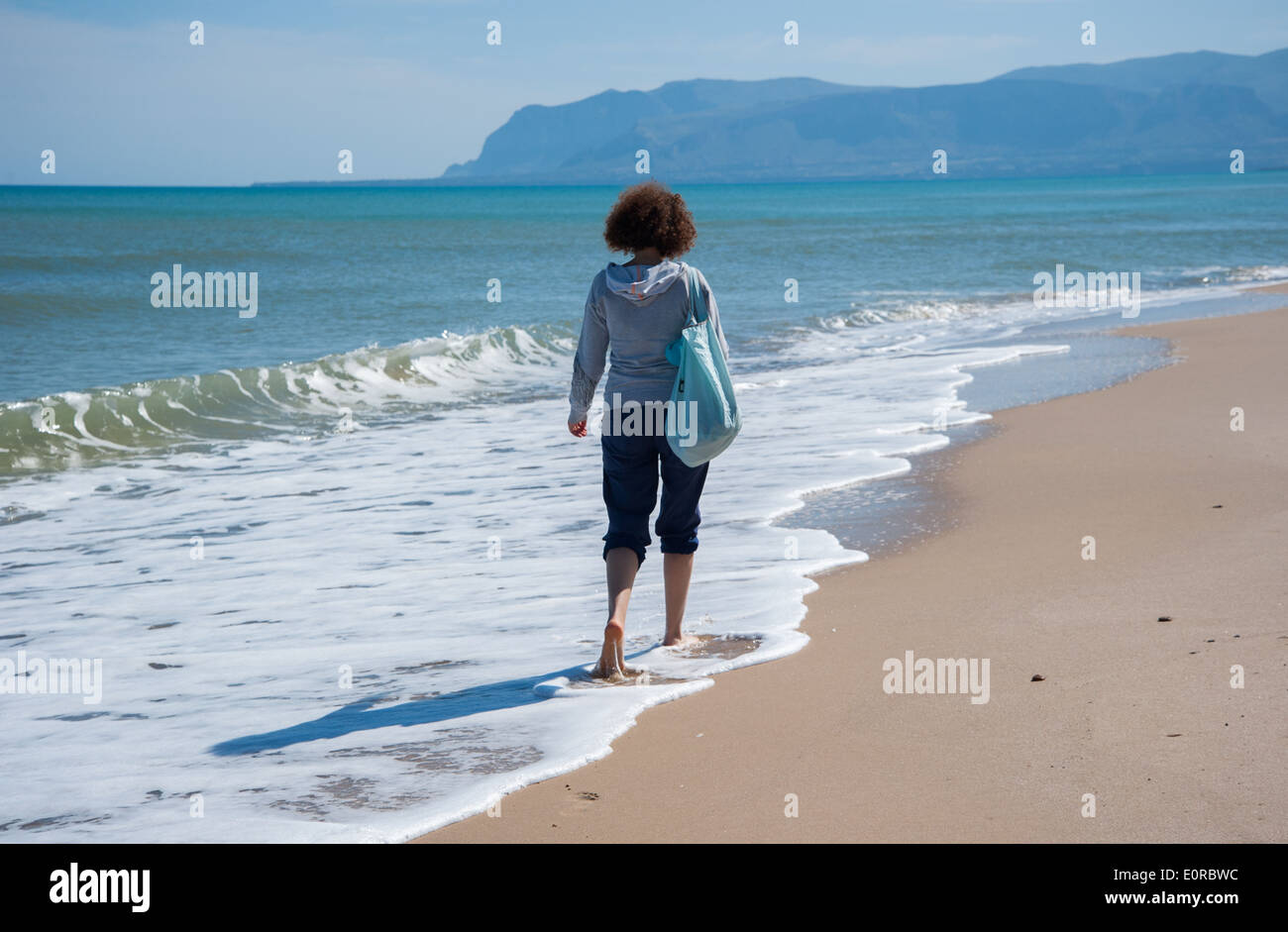 woman on the beach Stock Photo