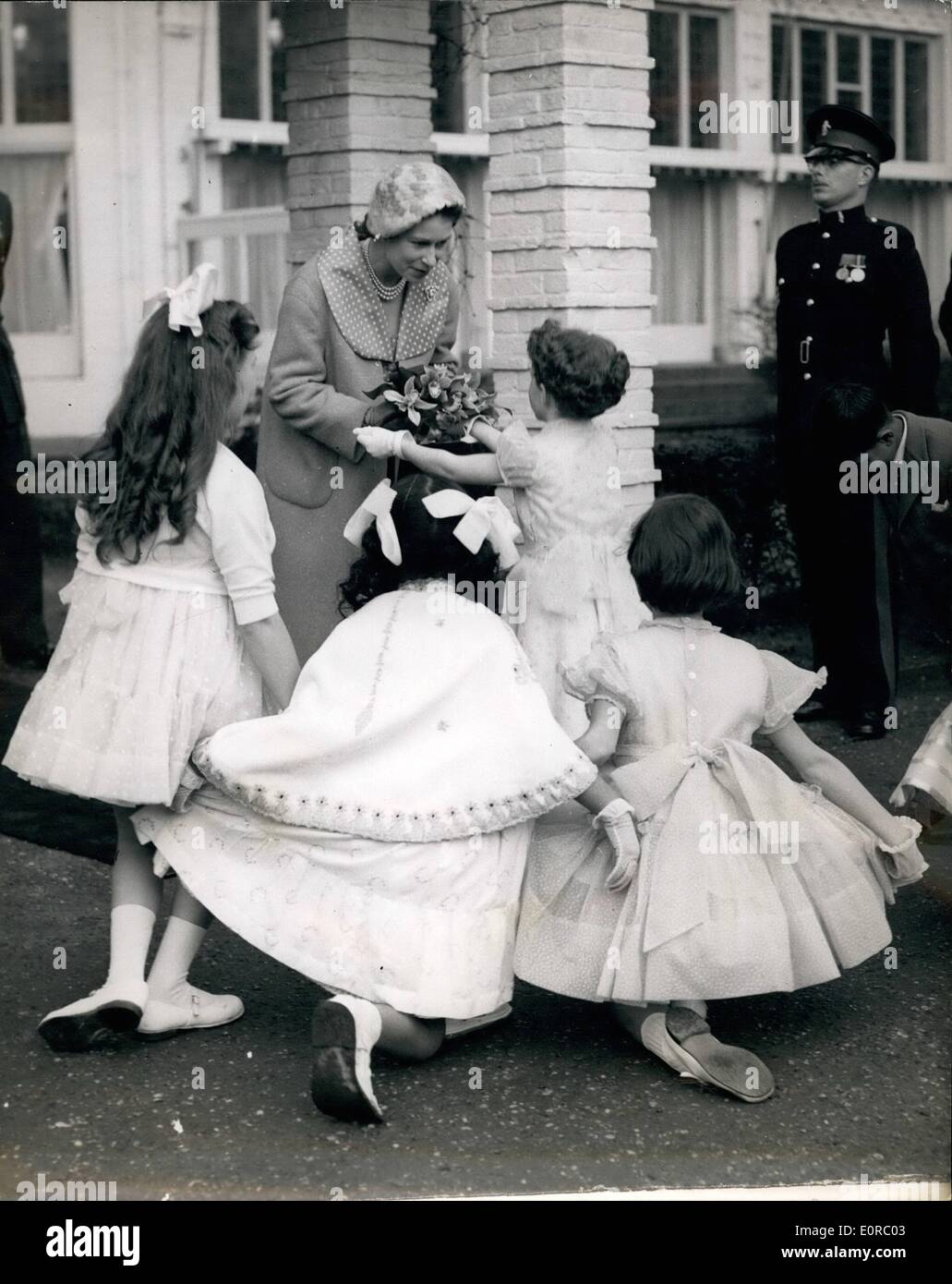 Dec. 12, 1958 - Bouquets For The Queen: Six children - representing the commonwealth - curtsy for H.M. The Queen and present her with a bouquet - after a reception at the Dierentuin, The Hague - during state visit to the Netherlands.. The actual presentation is being made by Ann McGlashan. Stock Photo