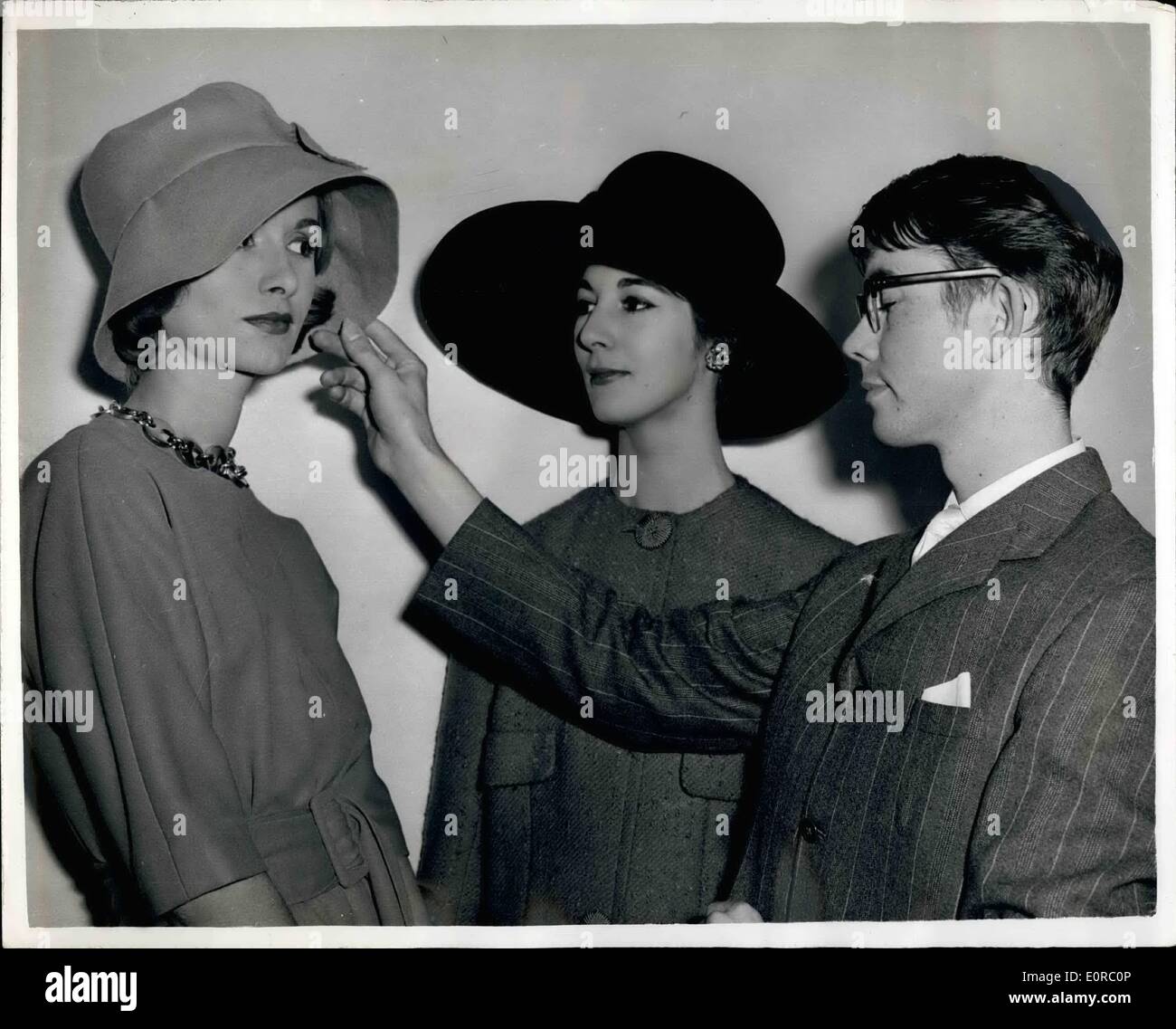 Dec. 12, 1958 - BRITISH YOUTH GETS A TOP JOB IN PARIS FASHIONS. GRAHALI SMITH, 20, of Bexley, Kent, a hat designer, ban juat landed a top Paris job.He hae been appointed chief designer of hate to the House of Lanvin-Castillo. Graham, four ycsro a student of the Royal College of Art, hit the jackpot in jabs when he was oalled to Paris by Lioneleur Ceetillo, hood of the fashion house. He went to Franco with all his savingo -K5, and woo asked to design oome bats ''on trial''. The directors were no impre000d that they offered him a job there and then Stock Photo