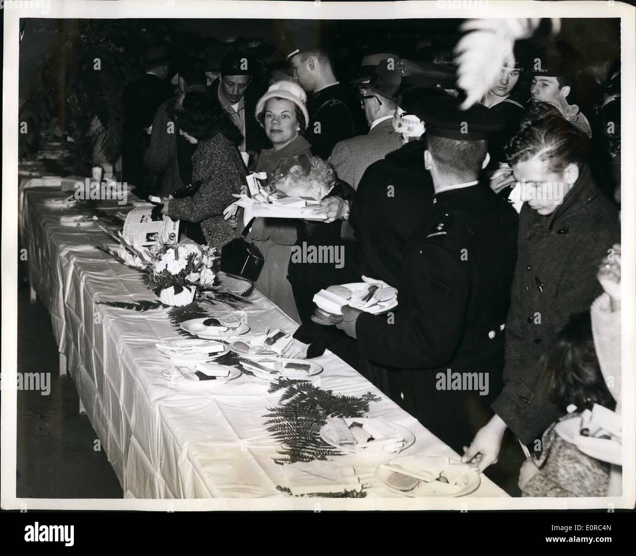 Jan. 01, 1959 - Guests are lining up as they pass the refreshment tables at the commissioning reception held on the hangar deck Stock Photo