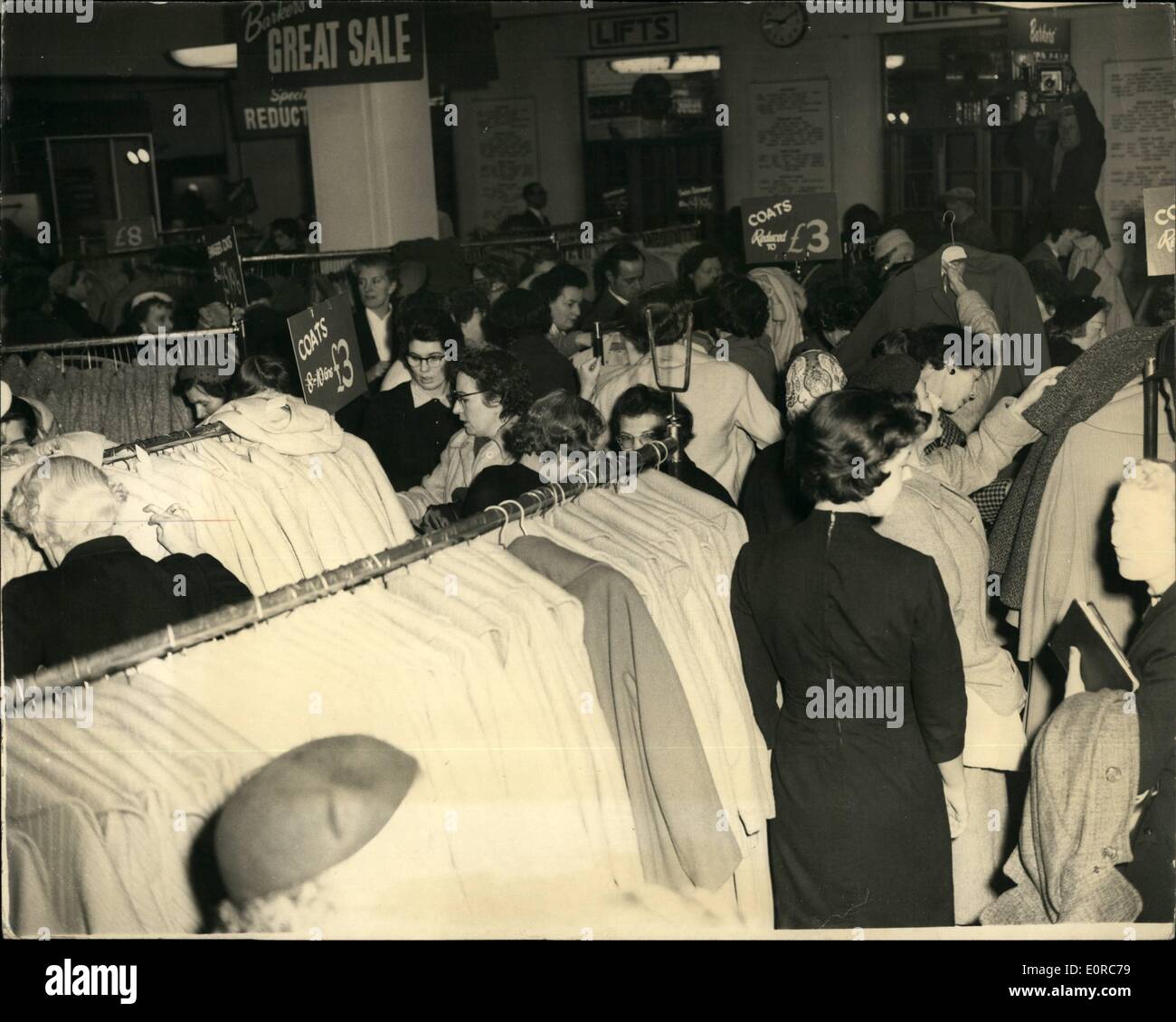 Dec. 12, 1958 - Sale at Barker's: Photo shows the scene at Barker's of Kensington this morning, as women hunt for bargain among Stock Photo