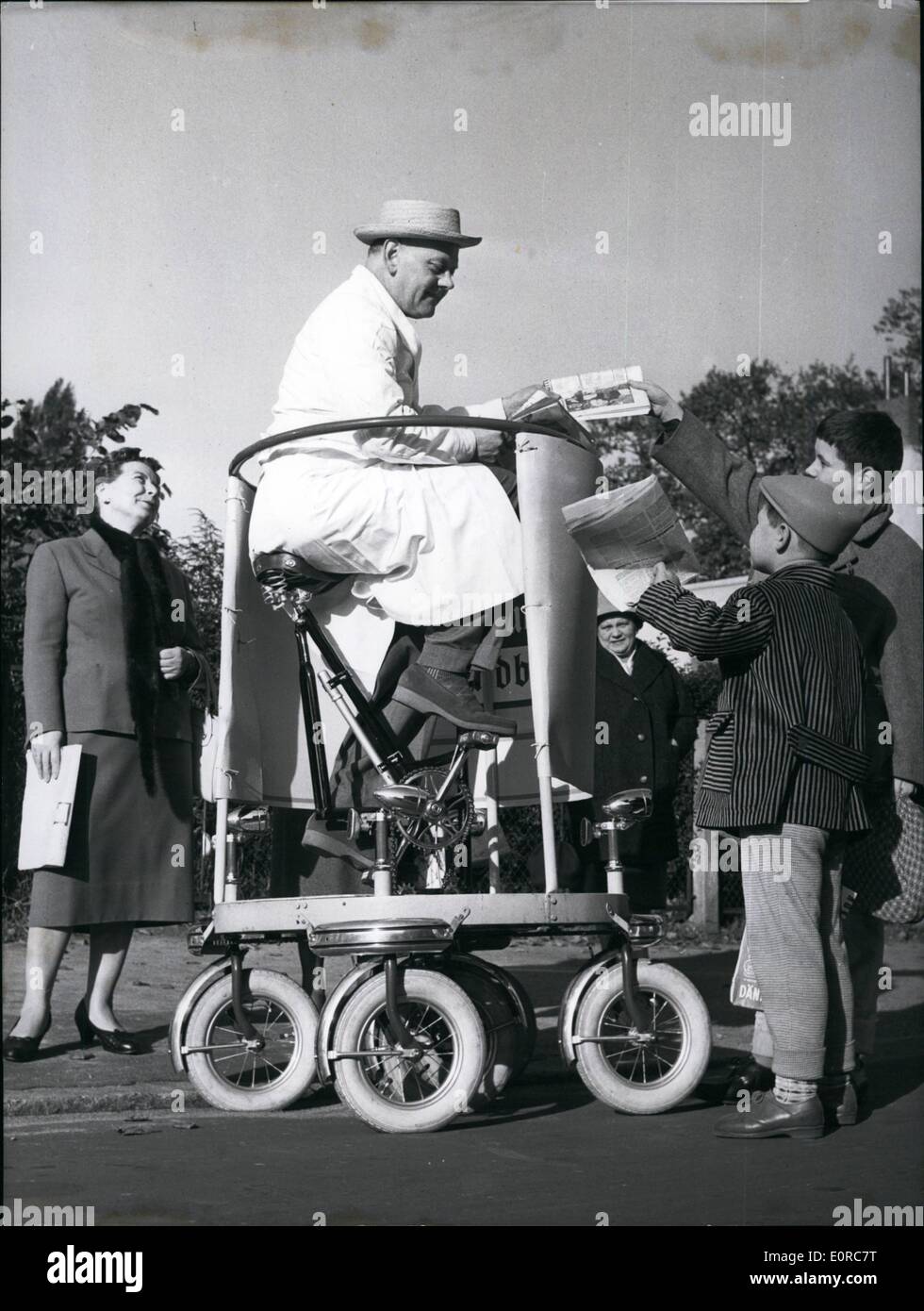 Dec. 12, 1958 - It's the right turn that matters: Ernst Schroeder from Hamburg has had taken a patent for it. This unusual vehicle has been developed by him and is now a spectacle in Hamburg. ''Rotoped'' he calls this rolling stall for news papers with five wheels. The wheel in the middle transfers the driving power. All five wheels are linked for the steering movement, and because of this the driver can suddenly change his direction in a right angle (standing by 90,180, and 360 degrees). Although there is a saddle and a pedal as there is on a bicycle, the vehicle has no steering wheel Stock Photo