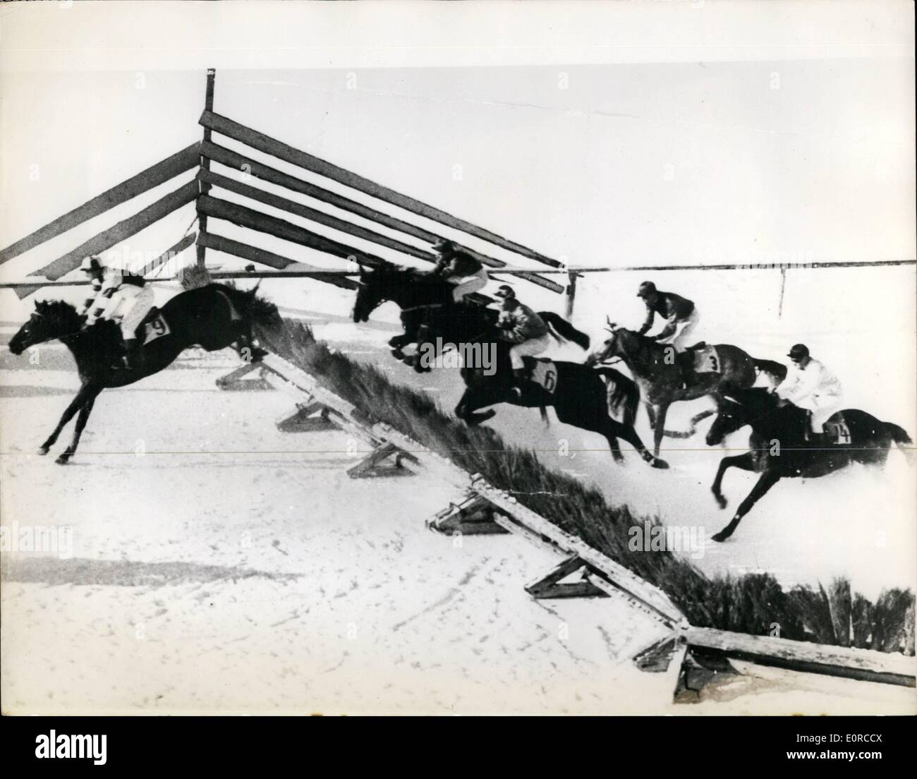 Jan. 01, 1959 - Racing across the snow - at arose - Switzerland: The field takes a hurdle during the snow racing for the ''Prize of Reetia'' - at Arosa, Switzerland. Leading is ''Torrigan'' who came in fifth; and then L-R; ''Prevete'' the winner; ''Fritta'' - ''Psyche II'' and ''Le Trouvere' Stock Photo
