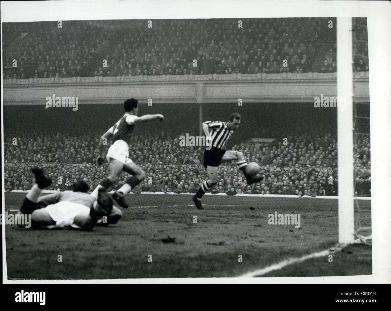 Feb. 02, 1959 - F.A. Cup fifth round. Arsenal versus Sheffield U. Visitors' first goal. Photo shows Simpson the Sheffield outside left scores his team's first goal during the F.A. Cup fifth round match with Arsenal this afternoon. Stock Photo