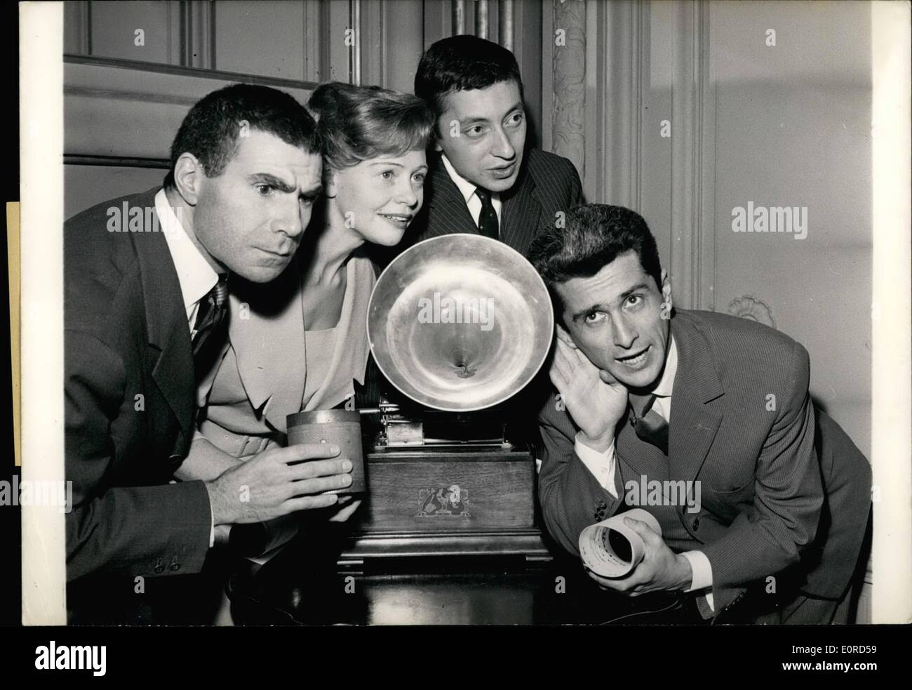 Mar. 03, 1959 - Best Recordings Erwarded: Prizes for the Best recordings were awarded to four young singers by the academy Charles cors in Paris last night. The occasion was the international congress of ''High Fidelity and Stereophony'' now being held in Paris. Picture shows: The Four Prize winners before a gramophone. From left to right: Serge insbourg, Denise Benoit, Marcel amont and Jacques Dufilho. Stock Photo