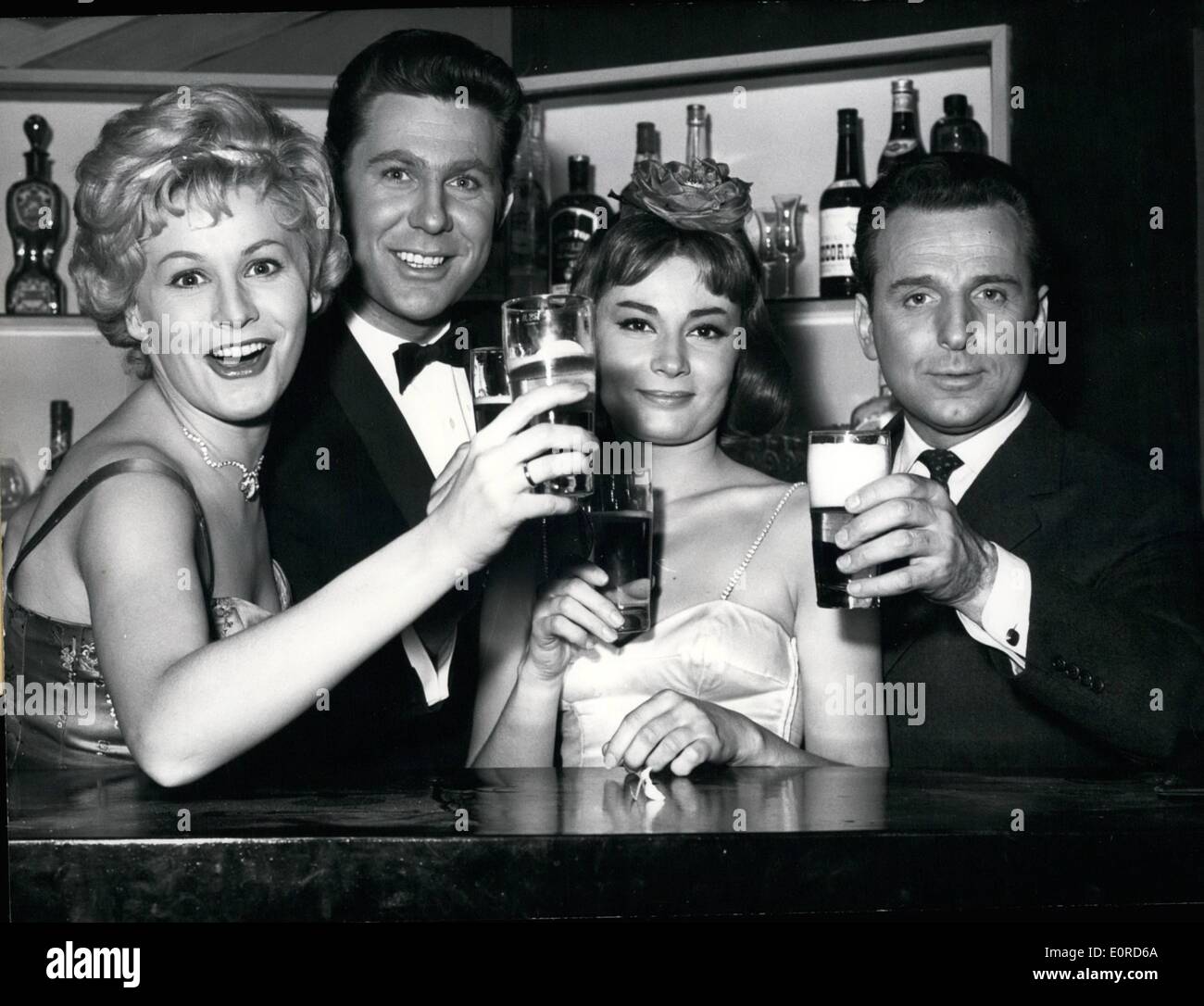 Mar. 03, 1959 - Cheers and happy Easter! ... said Waltraut Haas, Willy Hagara, Violette Ferrari and Georg Thomalla (from left: Waltraut Haas, Willy Hagara, Violette Ferrari, Georg Thomalla) who hope for a good start of their new film ''Red Pepper''. The film was made from the play by Max Reimann and Otto Schwartz ''The Jump into Marriage''. In the comedy, Ilona (Violetta Ferrari) shows that, in spite of all hinder things, in the end she nets the man she wants. Stock Photo