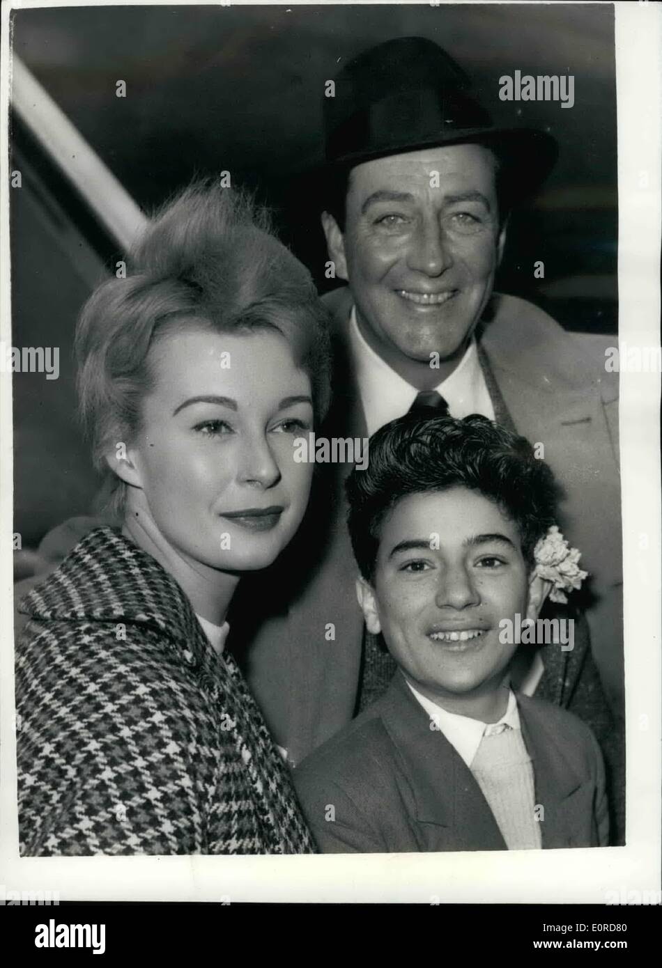 Feb. 02, 1959 - Robert Taylor and his co-stars leave for Africa: Screen star Robert Taylor left London Airport this afternoon for location in Africa - for his new film ''Adamson of Africa''. He was accompanied by his co-stars Anne Aubrey of London - and John Dimech - known by all as ''Pasha'' - a sixteen year old Maltese trainee waiter. Photo shows Robert Taylor - Anne Aubrey and John Dimech - at London Airport this afternoon. Stock Photo