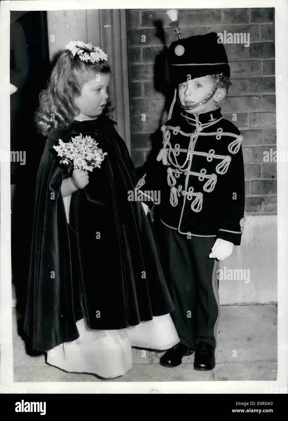 Feb. 02, 1959 - Today's Wedding: The Wedding took place today at St. Peter's, Eston Square, between Miss Ursula Christian Moore, 18-year old Daughter of Mr. and Mrs. Ollick Moore, of Mesdle, Buckingham shire, and Captain Micheal Cooper- Evans, 11th Hussars. Picture Shows: Two of the little attendants at teh Wedding, were four-year old Benedict Rambaut, wearing a miniature Hussers uniform, and five- year old Miranda Griniling. Stock Photo