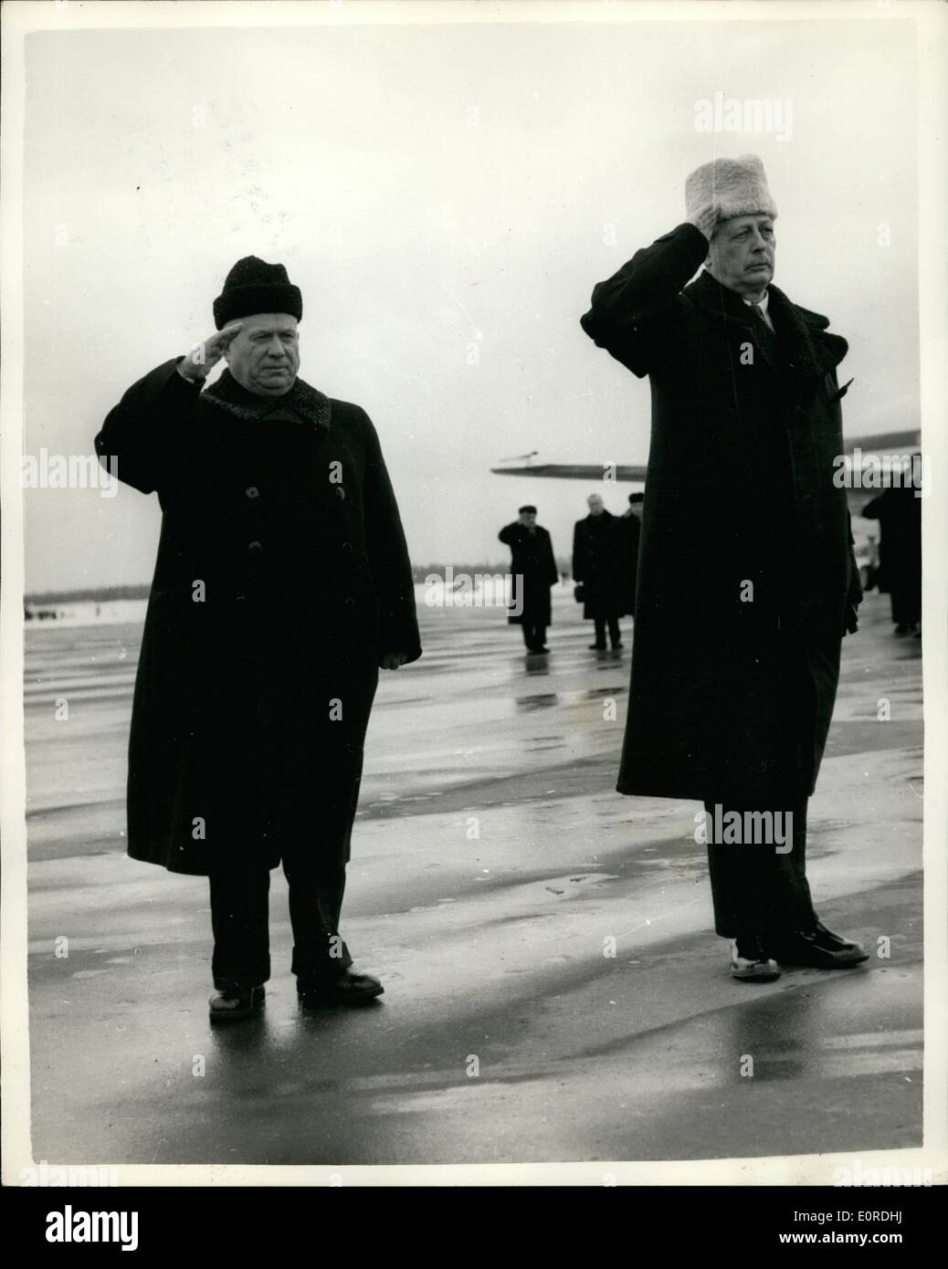 Feb. 02, 1959 - Mr. MacMillan in Moscow. Photo Shows: Mr. Harold MacMillan, (right), seen wearing a white furry hat, salutes with Mr. Kruschev, shortly after Mr. MacMillan's arrival at Moscow Airport on Saturday, after flying from London. Stock Photo