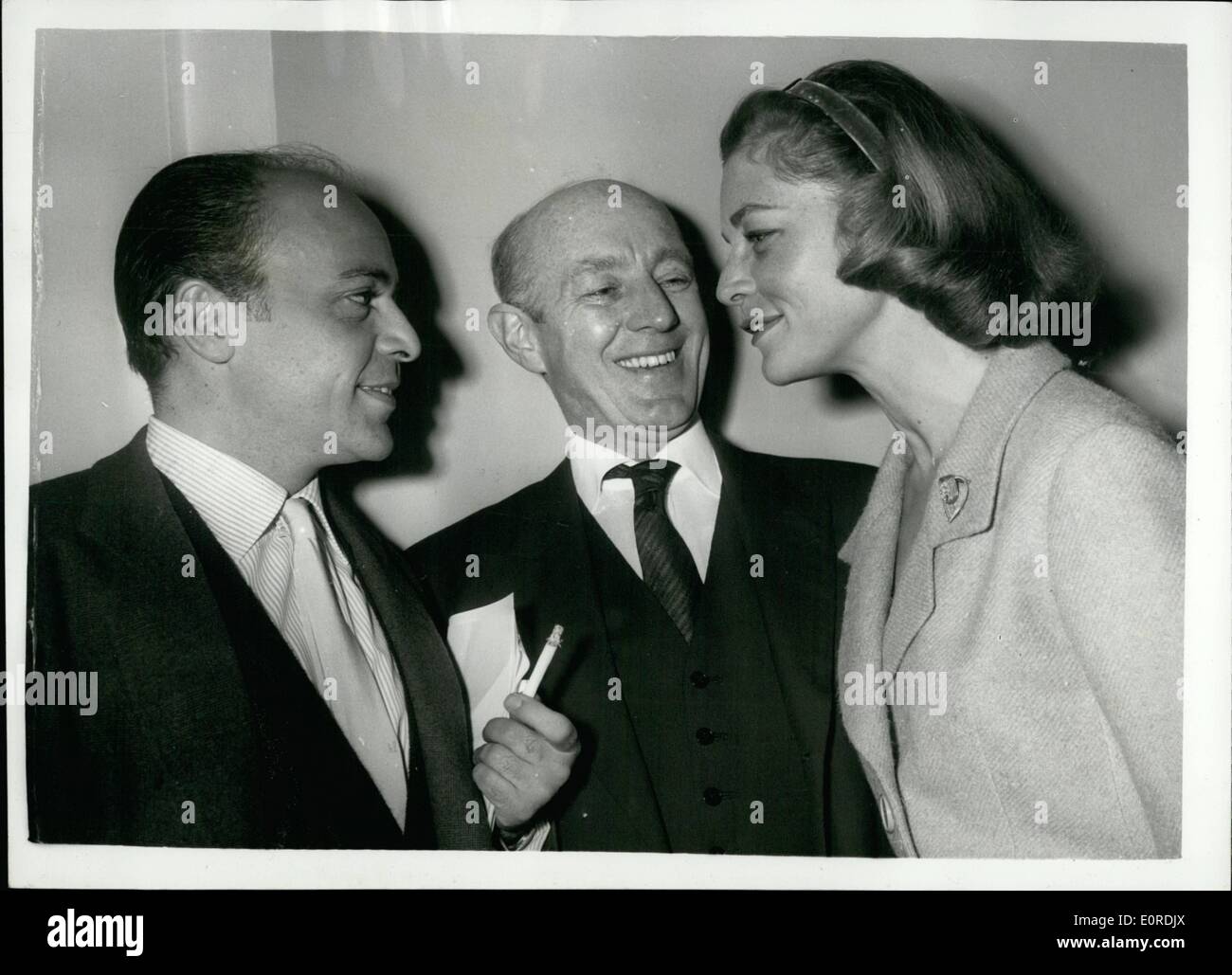 Feb. 02, 1959 - Luncheon in Honour of Sir Alec Guinness. A Luncheon was given in honour of Sir Alec Guinness by the Film Industry Publicity Circle - at the Savoy Hotel today. Photo shows (L to R) Herbert lom, Sir Alec Guinness and Lau En Bacali, seen at the Luncheon today. Stock Photo