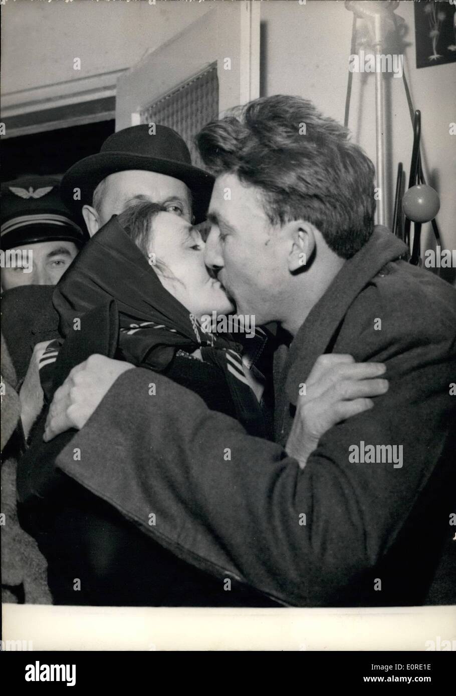 Feb. 02, 1959 - Mother's Joy: Six French Soldiers who were kept Prisoner near the Moroccan frontier were set free by the Algerian Rebels and handed over to Moroccan Authorities. They arrived at Villacoublay, a military Airport near Paris, last night. Photo shows Gilber Fillieux, one of the Freed Prisoners, Being kissed by his mother on arrival at Villacoublay last night. Stock Photo