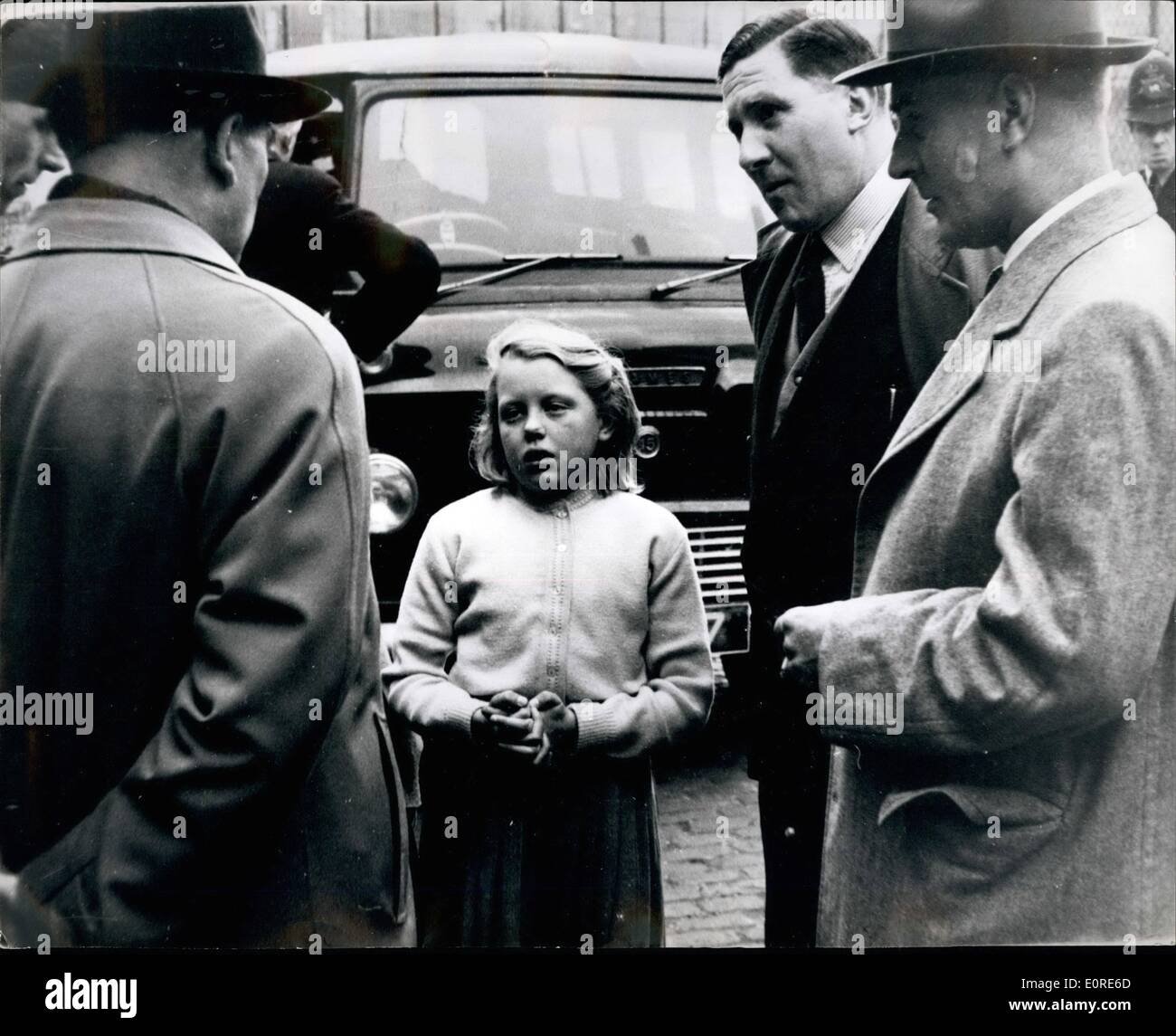 Apr. 04, 1959 - Ten-year-old Christine sees ,000 Mail Bag Robbery - and tells detectives all about it: Ten-year-old Christine Firestone was skipping her way home down a narrow, cobbled back street in Marylebone yesterday when she saw five masked men ambush a post office mail van. she saw the bandits drag out the driver and his mate, and then escape in a car with three begs full of registered packet containing ,000. Then fair-haired Christine told detectives all about it Stock Photo
