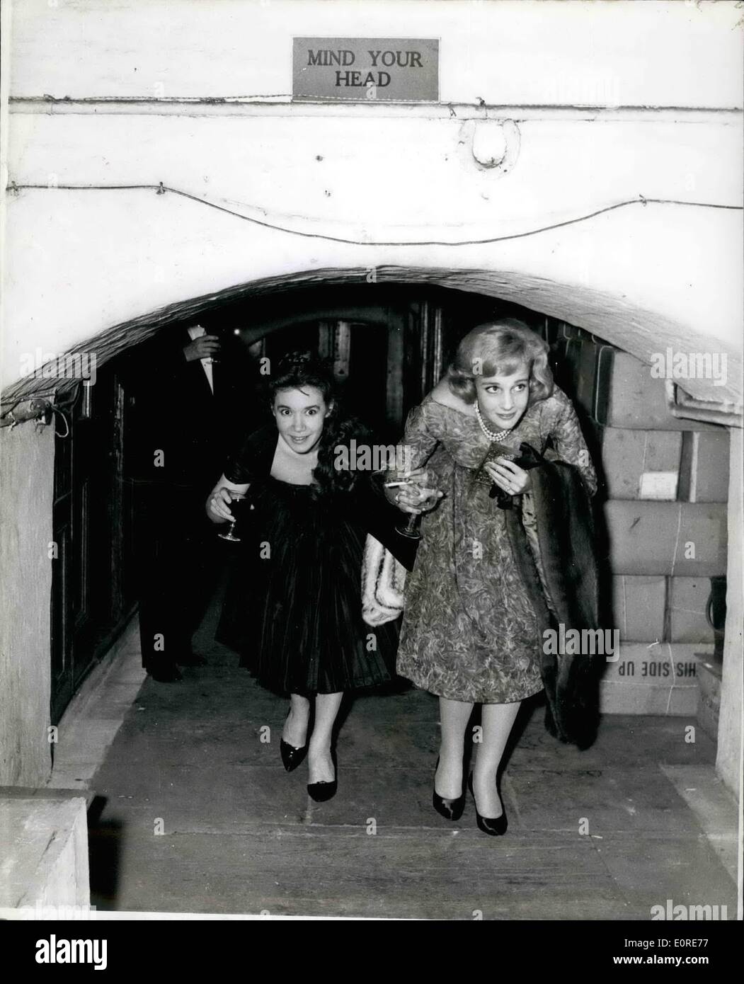Apr. 04, 1959 - Party Under Charing Cross Station: Impresario David Pelham last night threw a theatrical party under Charing Cross Station in remembrance of the French Resistance. and, of course, in honour of his new play The Hidden River, about that movement. Photo shows Bobo Sigrist (right) and Tamara Gilmore join last night's party. Stock Photo