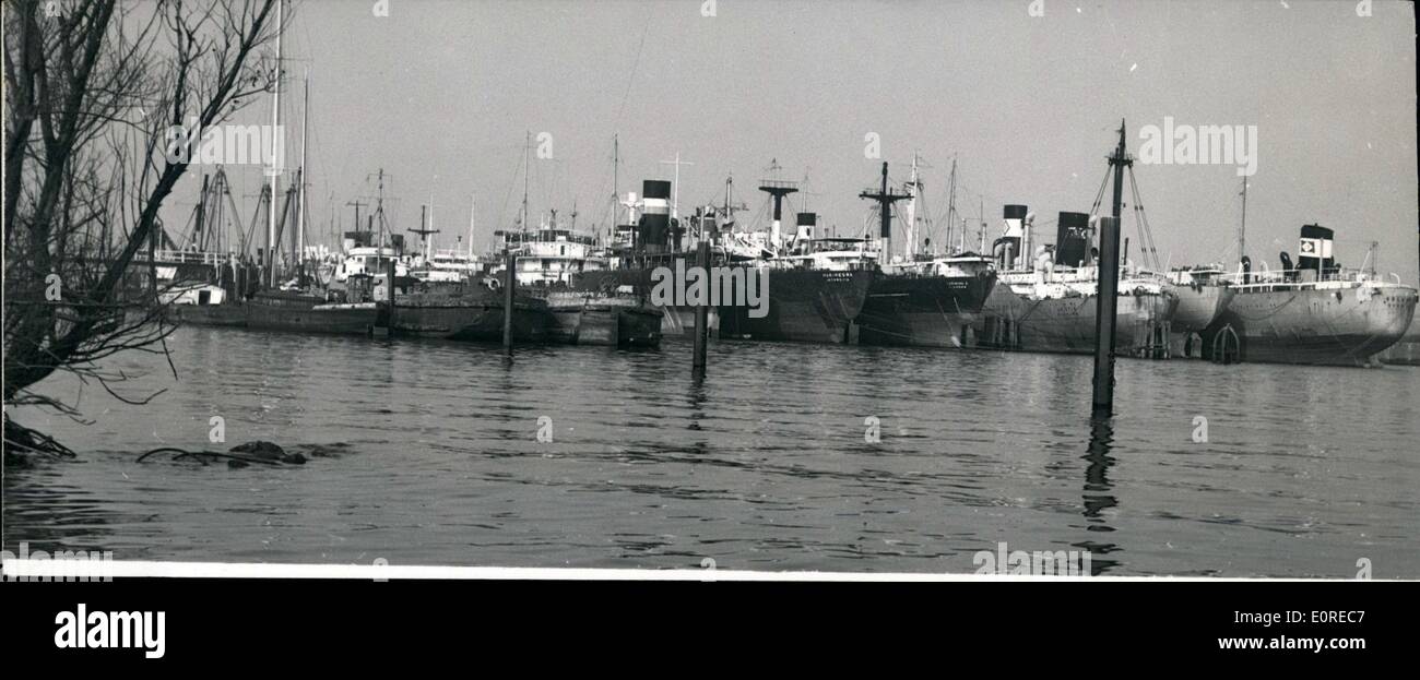 Mar. 03, 1959 - Relaxing pause - or ship cemetery: The world shipping is at a crisit. Also 88 German ships are lying idly at the poles in Hamburg Waltershof, modern freighters and tanks with nearly half million tons load capacity. The old sea-men do not like this picture, they still remember the time in the thirties, when Waltershof became ''famous'' as ship-cemetery. Experts think that also the next few months things will not be too rosy, and every sea man is glad if he has a sailing ship under his feet. Photo shows the ship lying place in Hamburg-Waltershof/Germany. Stock Photo