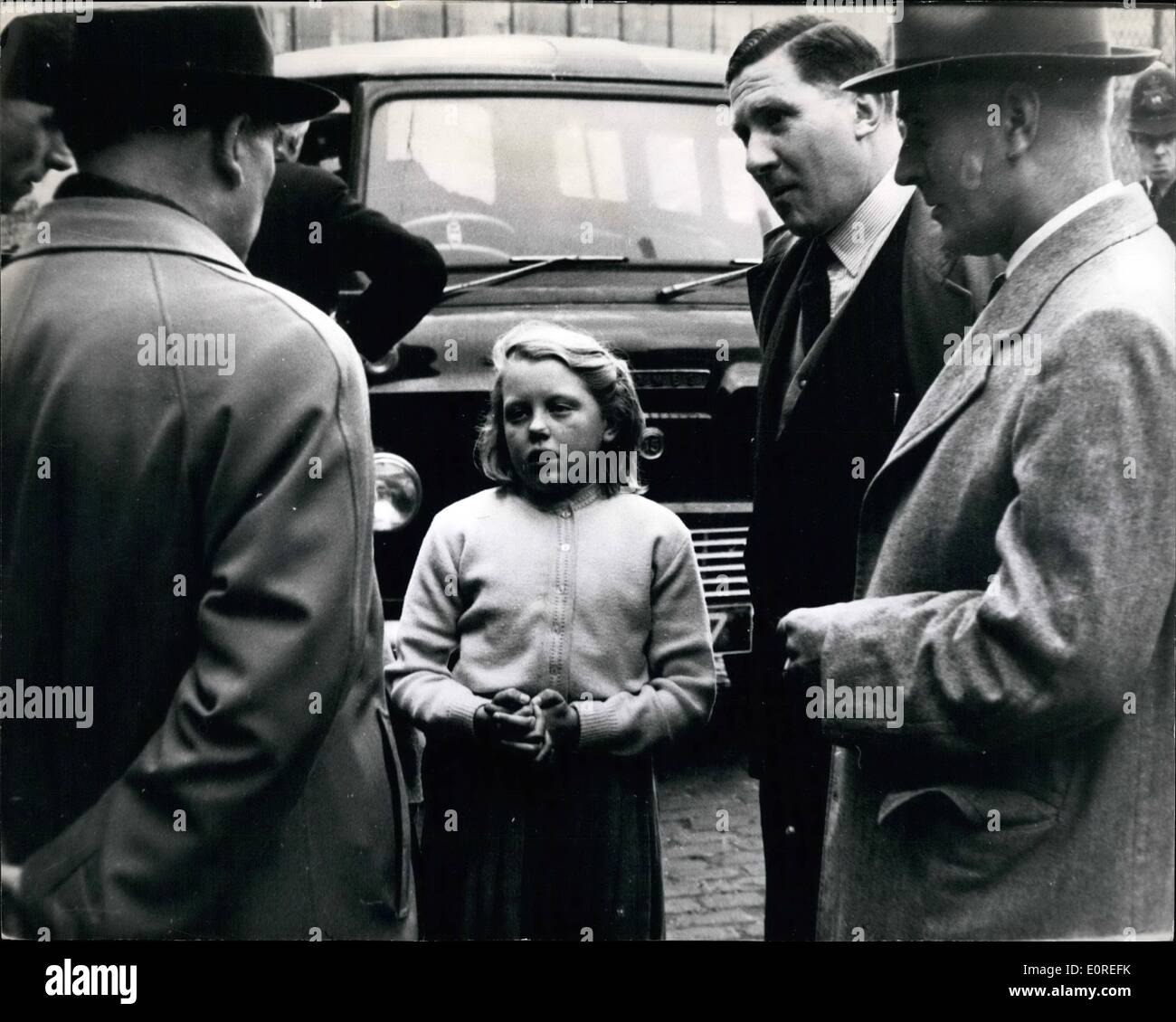 Apr. 04, 1959 - Ten-Year-old Christine sees ,000 mail bag Robbery - and tells detectives all about it: Ten-years-old Christine firm stone was skipping her way home down a narrow, cobbled back street in Marylebone yesterday when she saw five masked men ambush a post office mail van. She saw the bandits drag out the driver and his mate, and then escape in a car with three bags full of registered packets containing ,000. Then fair-haired Christine told detectives all about it Stock Photo