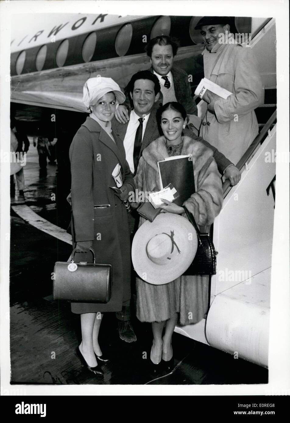 Apr. 04, 1959 - Film stars leave for Canary Islands: Film stars including Eva Bartok, Pier Angeli, Richard Attenborough and John Gregson, left Gatwick Airport today for the Canary Islands, for location shooting of the film ''S.O.S. Pacific''. Photo shows Eva Bartok, John Gregson and Clifford Evans, pictured prior to their departure today. Stock Photo