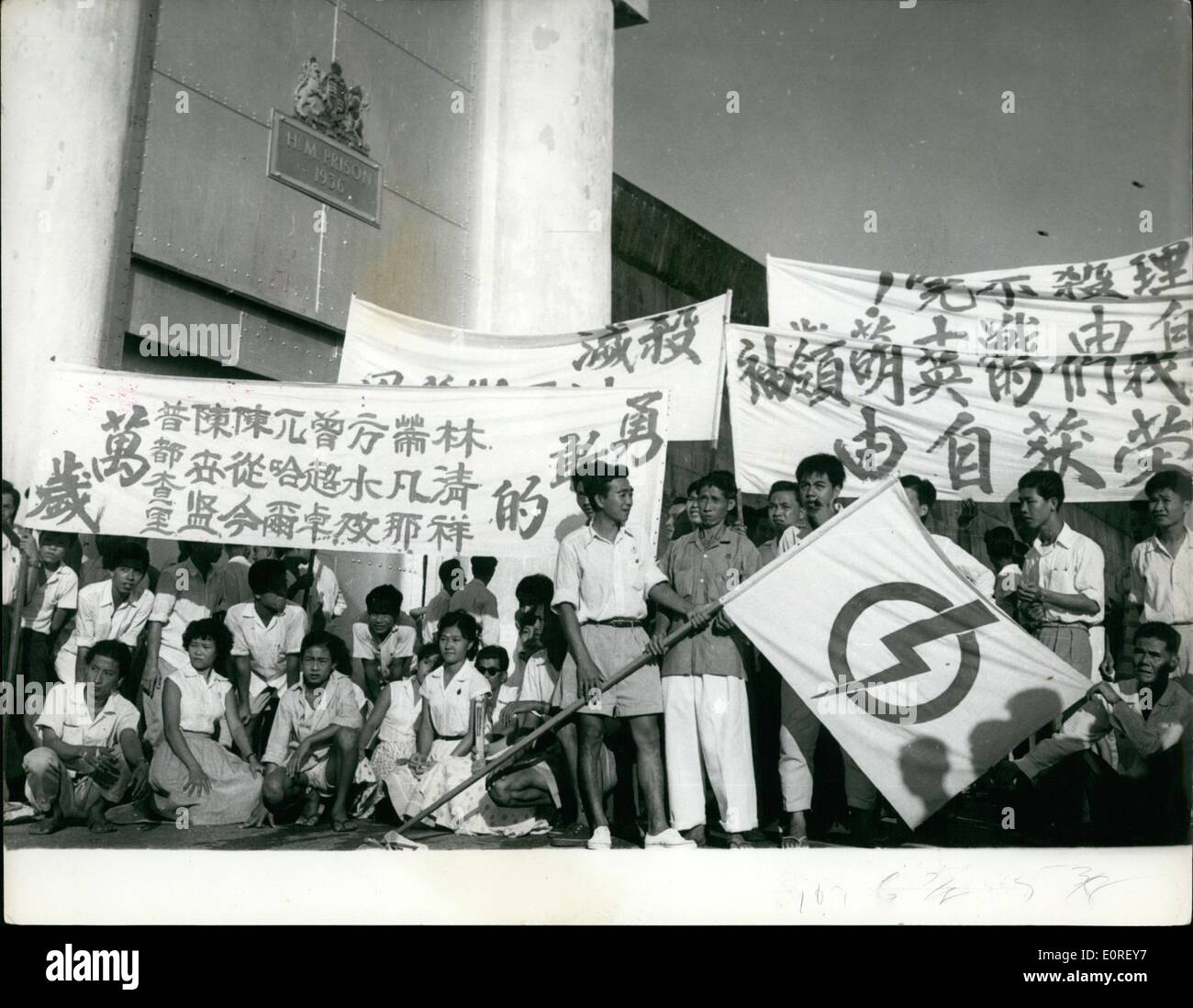 Jun. 06, 1959 - People's action party Members Released from Jail : The eight members of the people's Action party - which recently won the Singapore elections - and who have been held in Changi Jail since the 1956 riots - have been released. This follows an ultimatum from the leader of Party - Mr. Lee Kuan yew the Prime minister designate - that he would not from a Government until the men were released. Singapore has been declared an independent state withing the Commonwealth. Photo shows Youthful supporters with their banners outside the prison gates - prior to release of the detainees. Stock Photo