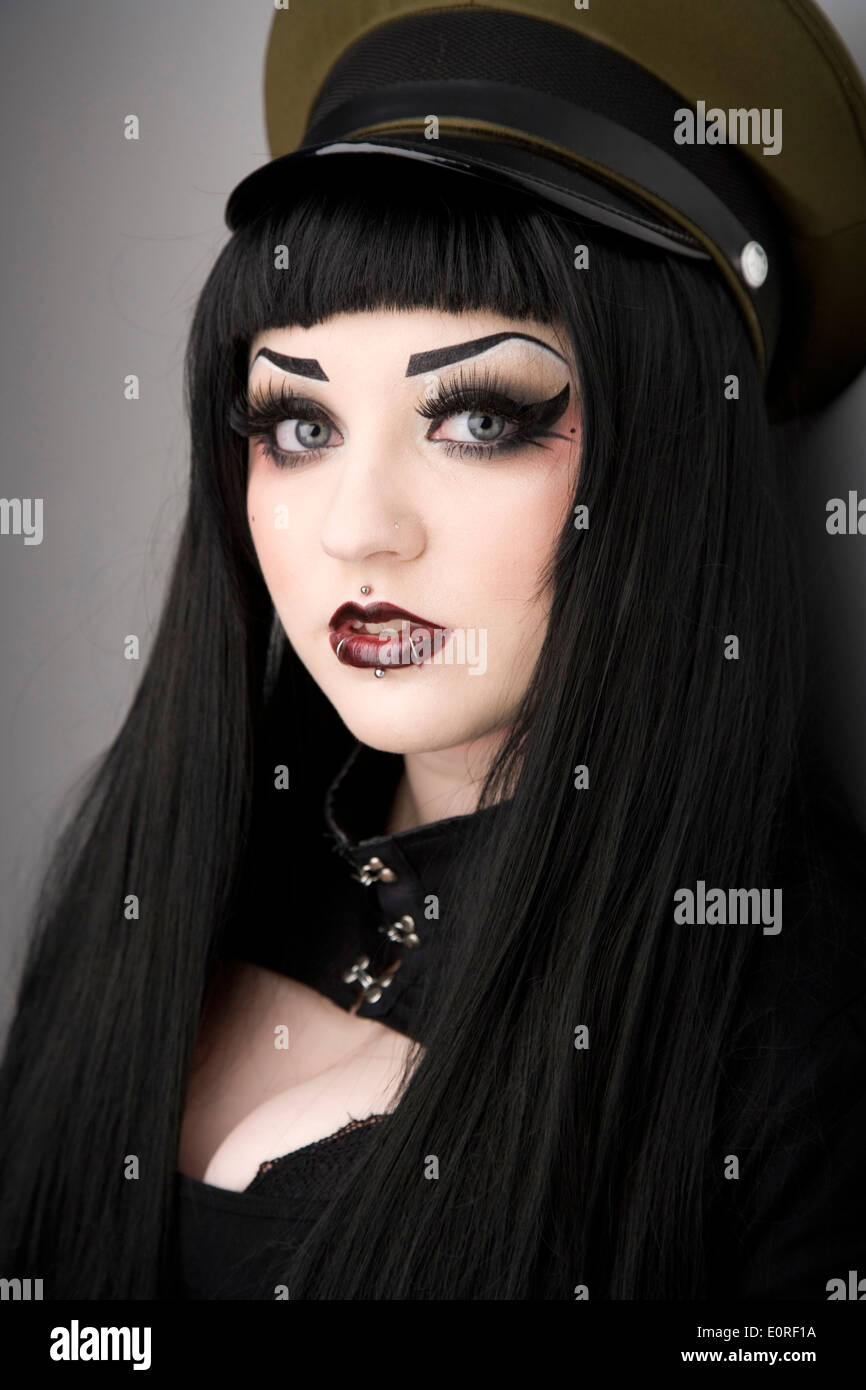 Gothic looking girl with face piercings Stock Photo - Alamy