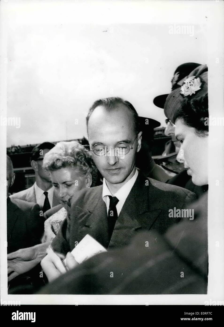 Jun. 06, 1959 - Atom Traitor -Klaus Fuchs Flies To East Germany: Klaus Fuchs was yesterday released from Wakefield Jail - having completed 9 1/2 years of his sentence - for disclosing atom secrets.. He travelled to London Airport - and then on Polish Airways machine to East Germany. Photo Shows: Klaus Fuchs - at London Airport yesterday. The woman is not named. Stock Photo