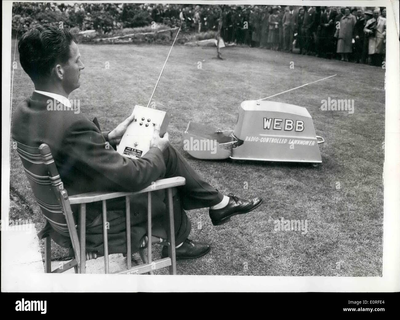 May 05, 1959 - Radio-Controlled Lawn Mower On Show At The Chelsea Flower Show: The first radio-controlled lawn mower will be shown to the public for the first time at tomorrow's opening of the Chelsea Flower Show.The mower travels at nearly 2 m.p.h., has a 14-inch cutting width and makes 60 clips to the yard. It has independent ''four-point'' suspension to ride undulations in the lawn. Its 1/3 h.p. 24-volt battery operated motor is remotely controlled by two switches on the user's radio transmitter. The effective range of radio control is up to a mile Stock Photo