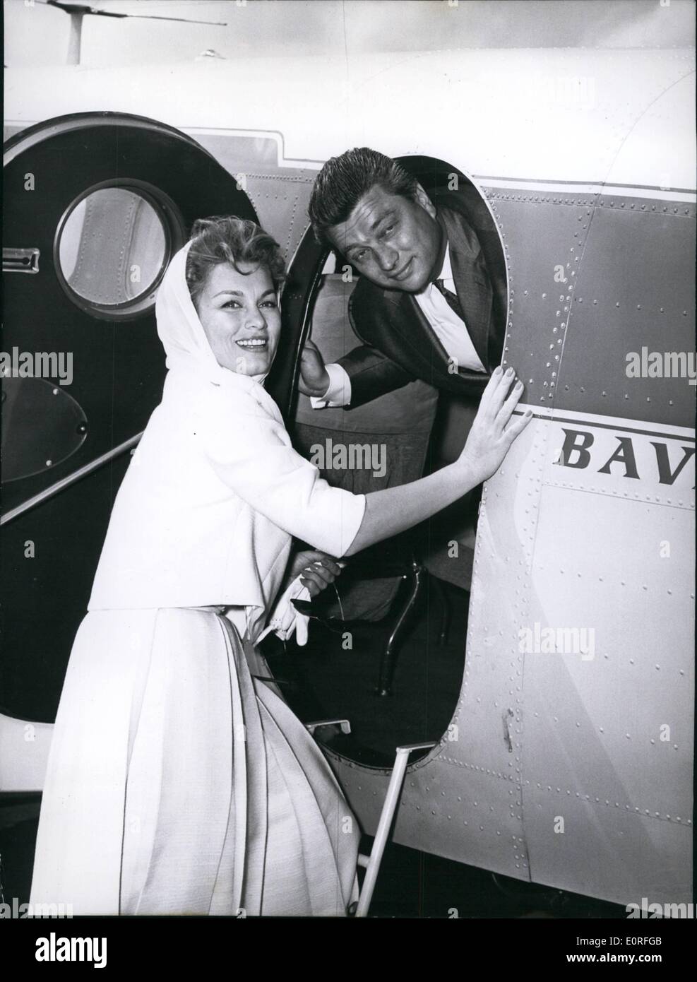 May 05, 1959 - On their departure to the Cannes Film Festival by charter airplane, our photographer trapped Hollywood scandal star Linda Christian (Linda Christian) on the Munich airport with the Munich film gossip Hunter (Hunter). Linda Christian can say of herself that at the time being she is one of the most interesting personalities for the film gossip. Ex wife of the late Tyrone Power, girl friend of the racing motorist Alfonso Marquis de Portago who died in an accident and acquainted with the international crime of the playboys she is in Germany hardly known by her films Stock Photo