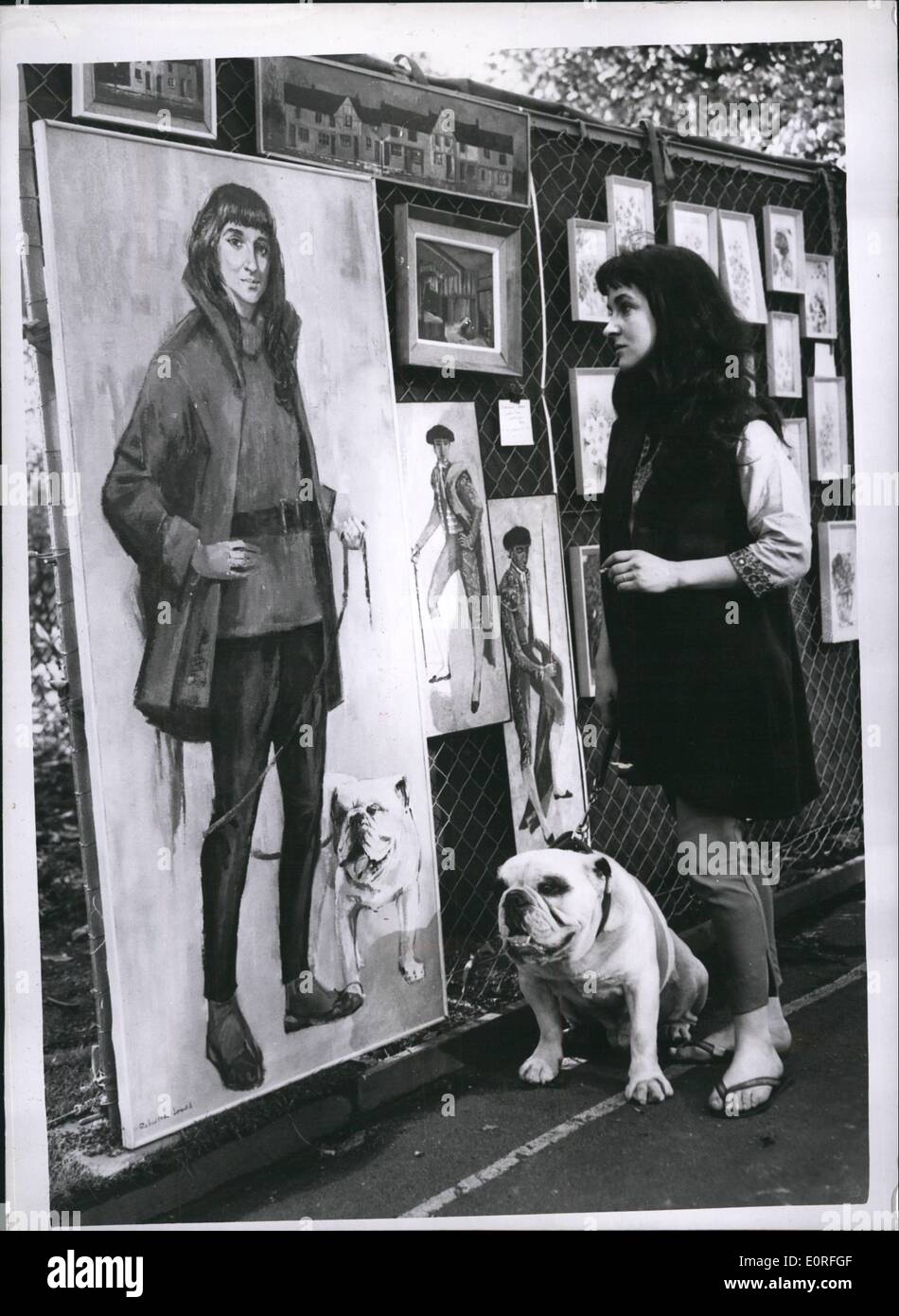 May 05, 1959 - The Annual Display of Paintings at Victoria embankment gardens: For the 12th successive year the London County Council's annual display of paintings was held at the Victoria's Embankment Gardens today. Photo shows Rosemary Harrison, of Hampstead, and her bulldog ''Timbo'' look at their portrait which was painted by Deborah Jones. Stock Photo