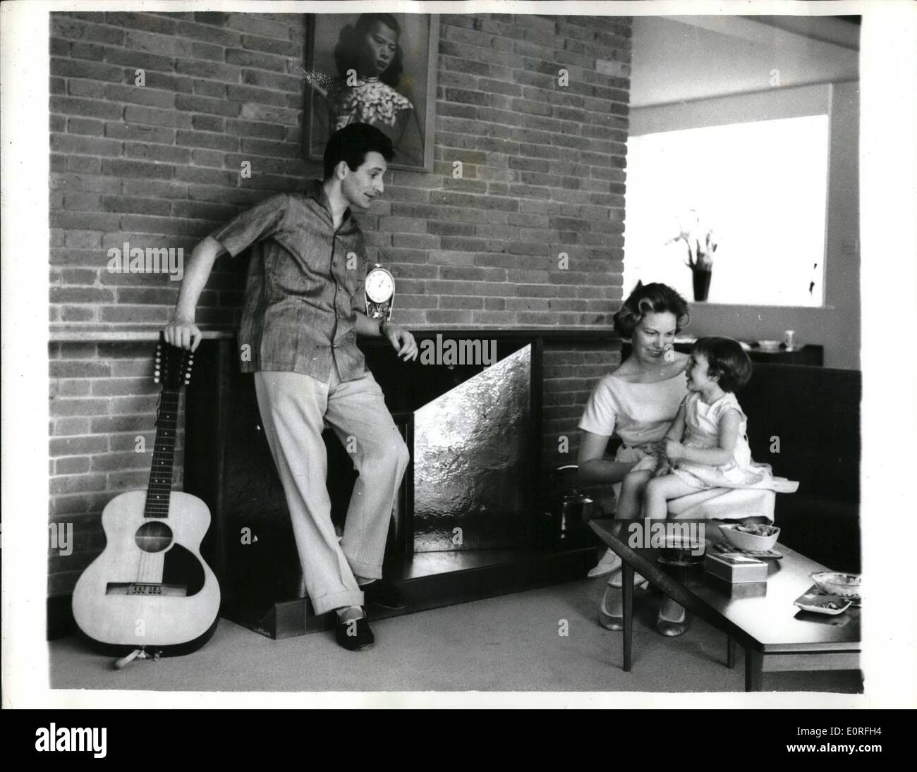 May 05, 1959 - Lonnie Donegan in New House. Photo shows Skiffle king Lonnie Donegan pictured with his wife, Maureen and their three-year old daughter Fiona in their new &pound;11,000 house on the edge of Epping Forest. Stock Photo